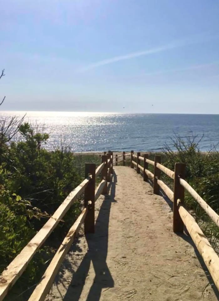 This scenic sandy path with rustic wooden railings leads you directly to the beach. It provides a short and easy walk from the property to the beautiful shoreline and ocean waves.
