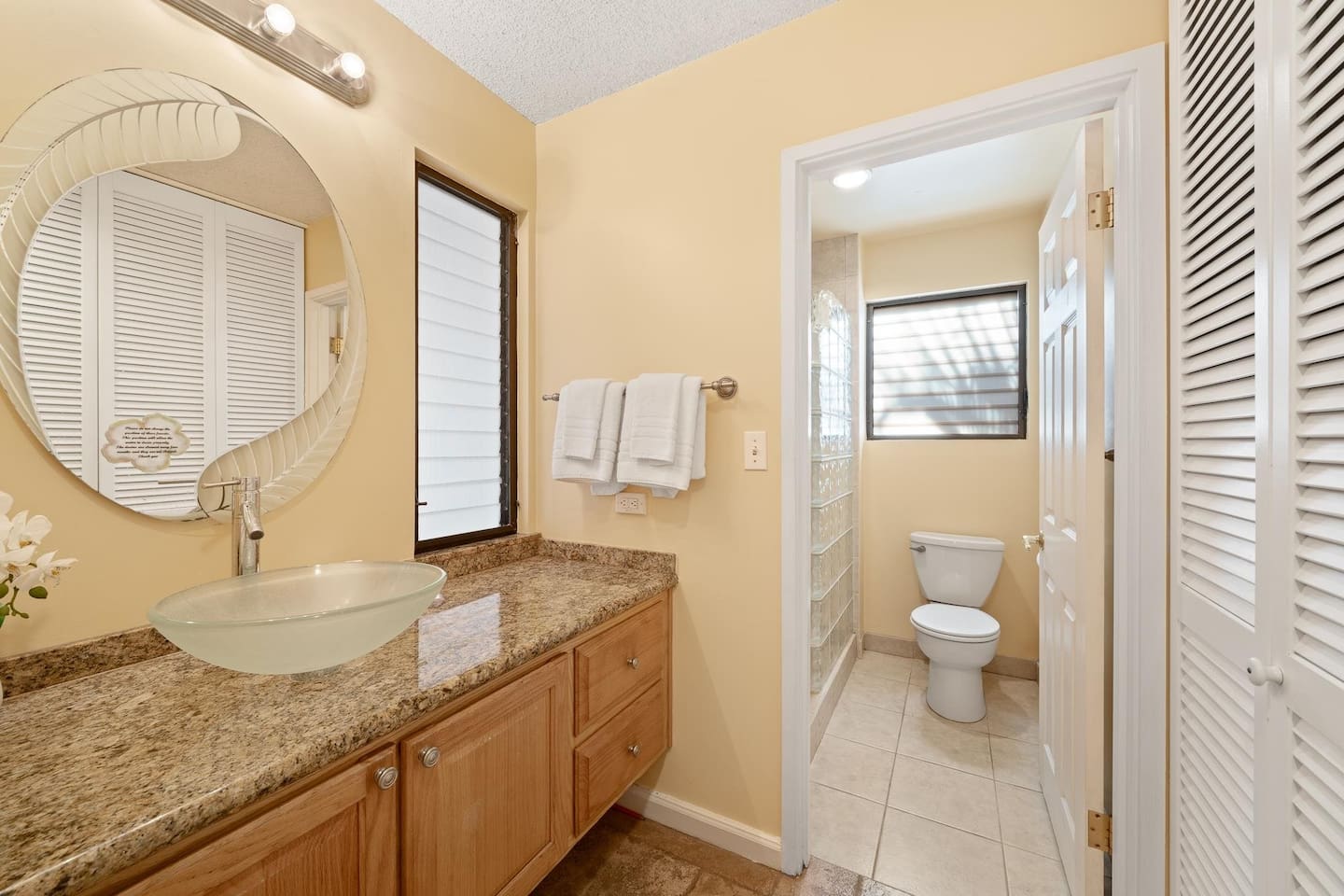 Second bathroom - features a walk-shower, vanity, and closet for additional storage