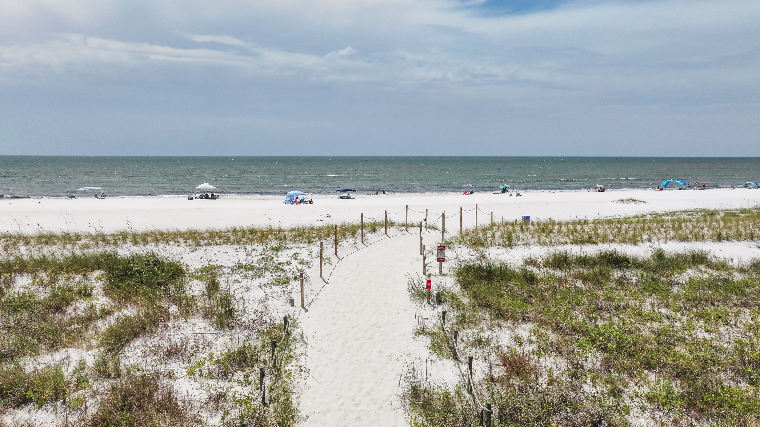 Take the sandy path to the beach and enjoy easy access to beautiful white sand, Gulf waters, and unforgettable coastal sunsets