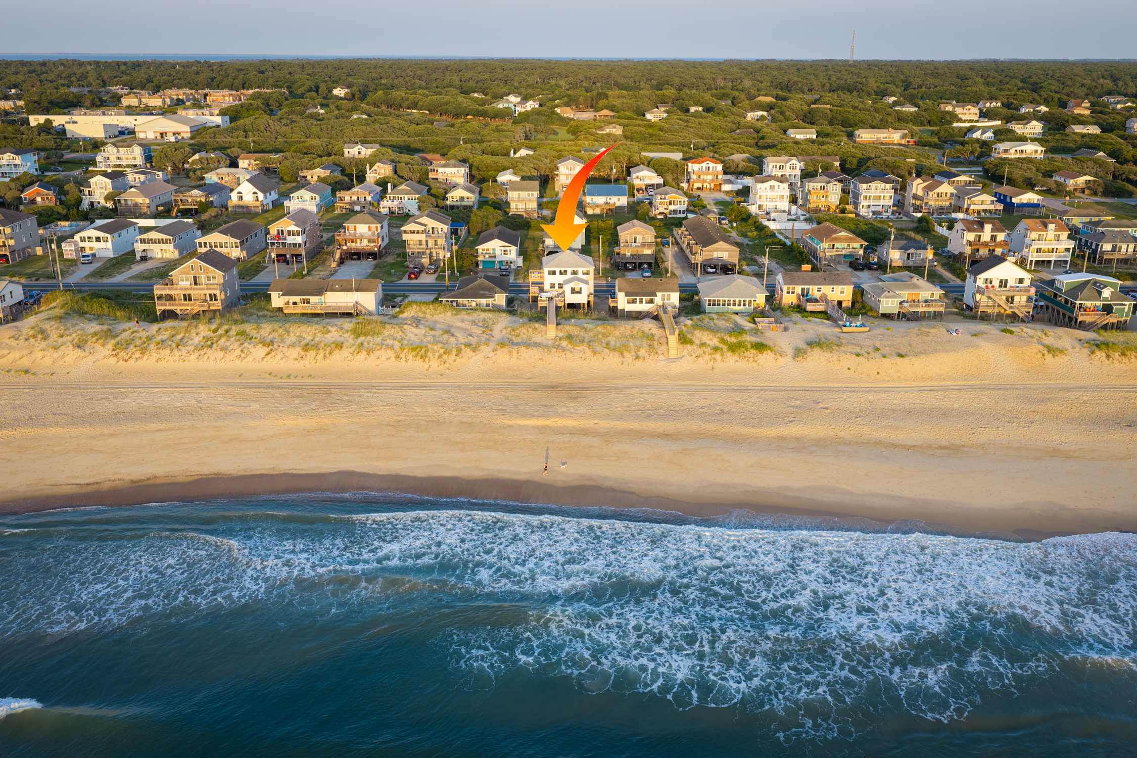 Aerial View from Ocean towards House and Beach
