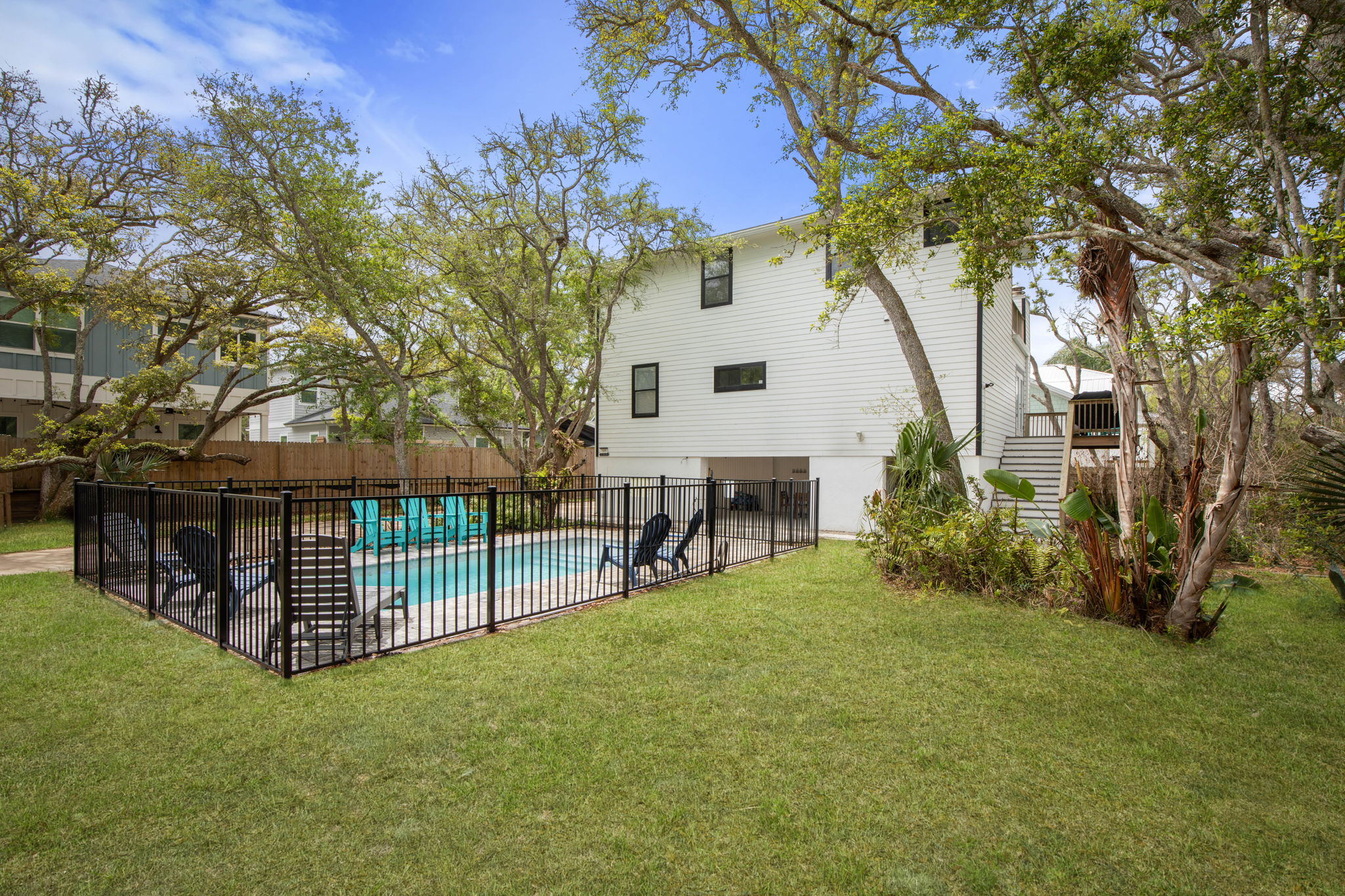 Tucked beneath the trees, this private retreat gives family room to breathe—kids racing from the lawn to the pool, parents lingering in the shade, and every sunlit hour unfolding into the kind of relaxed getaway you will talk about long after you leave.