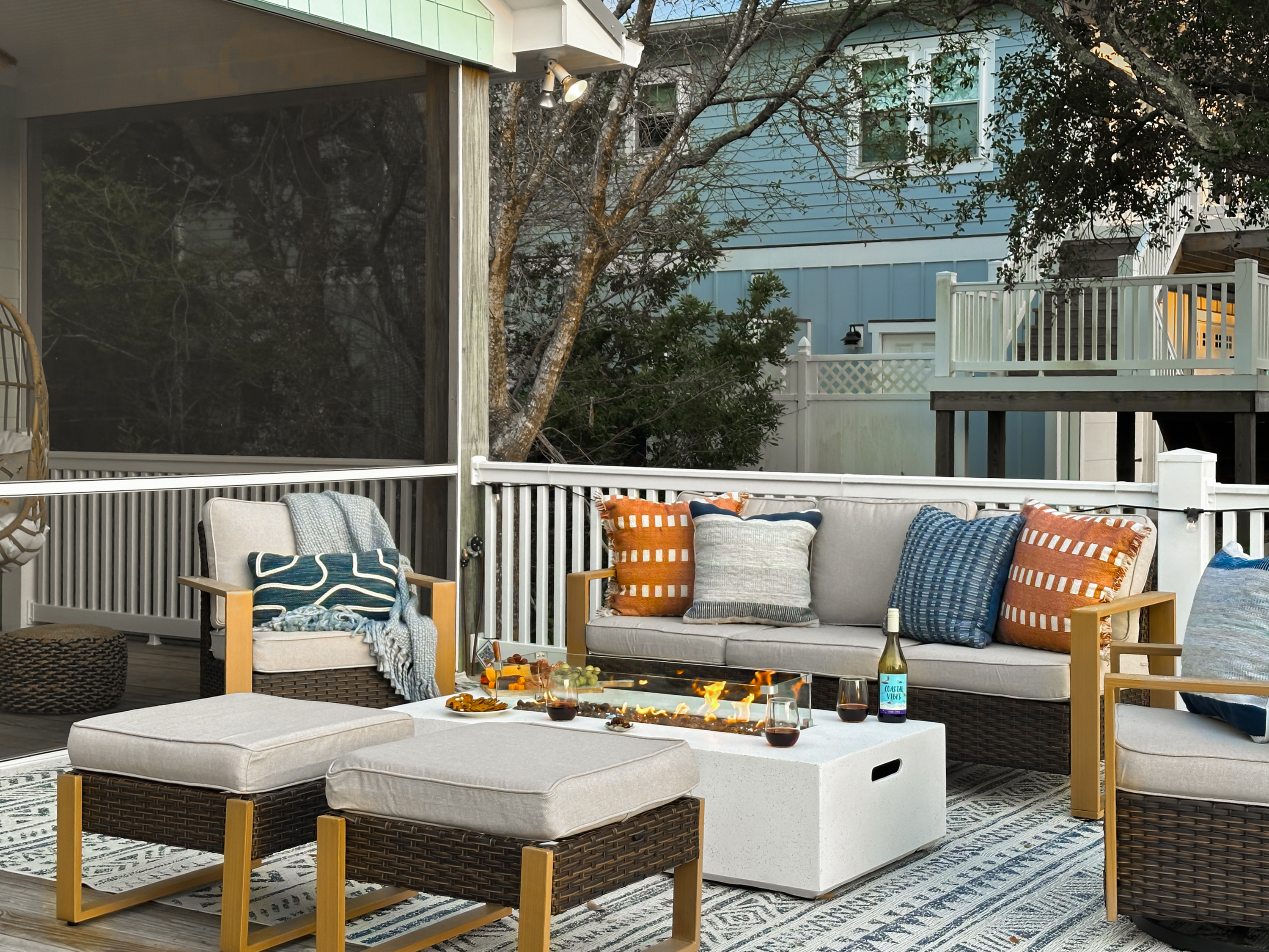 The fire table is surrounded by a cozy seating area.