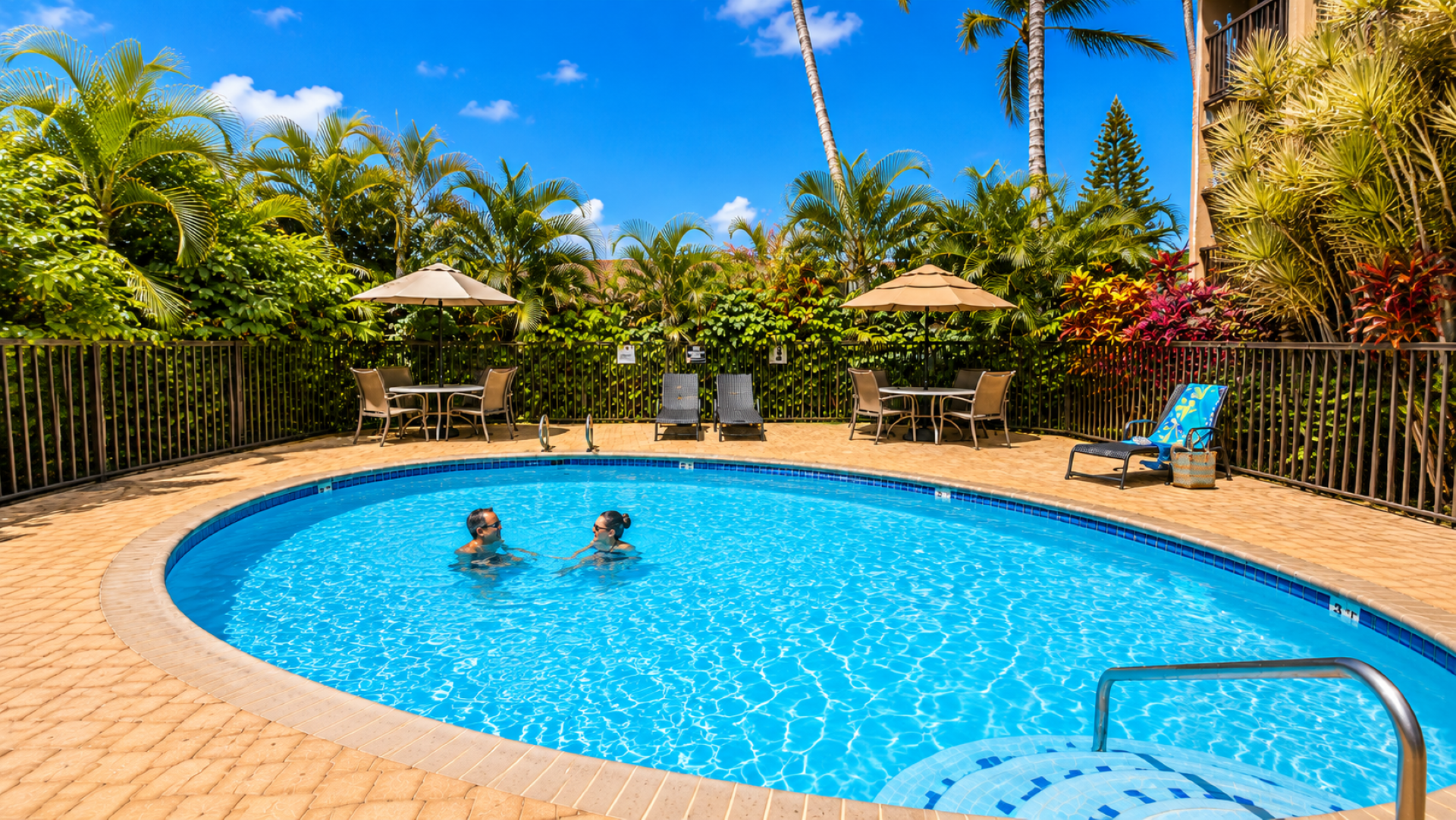 One of 3 swimming pools on property, one per building