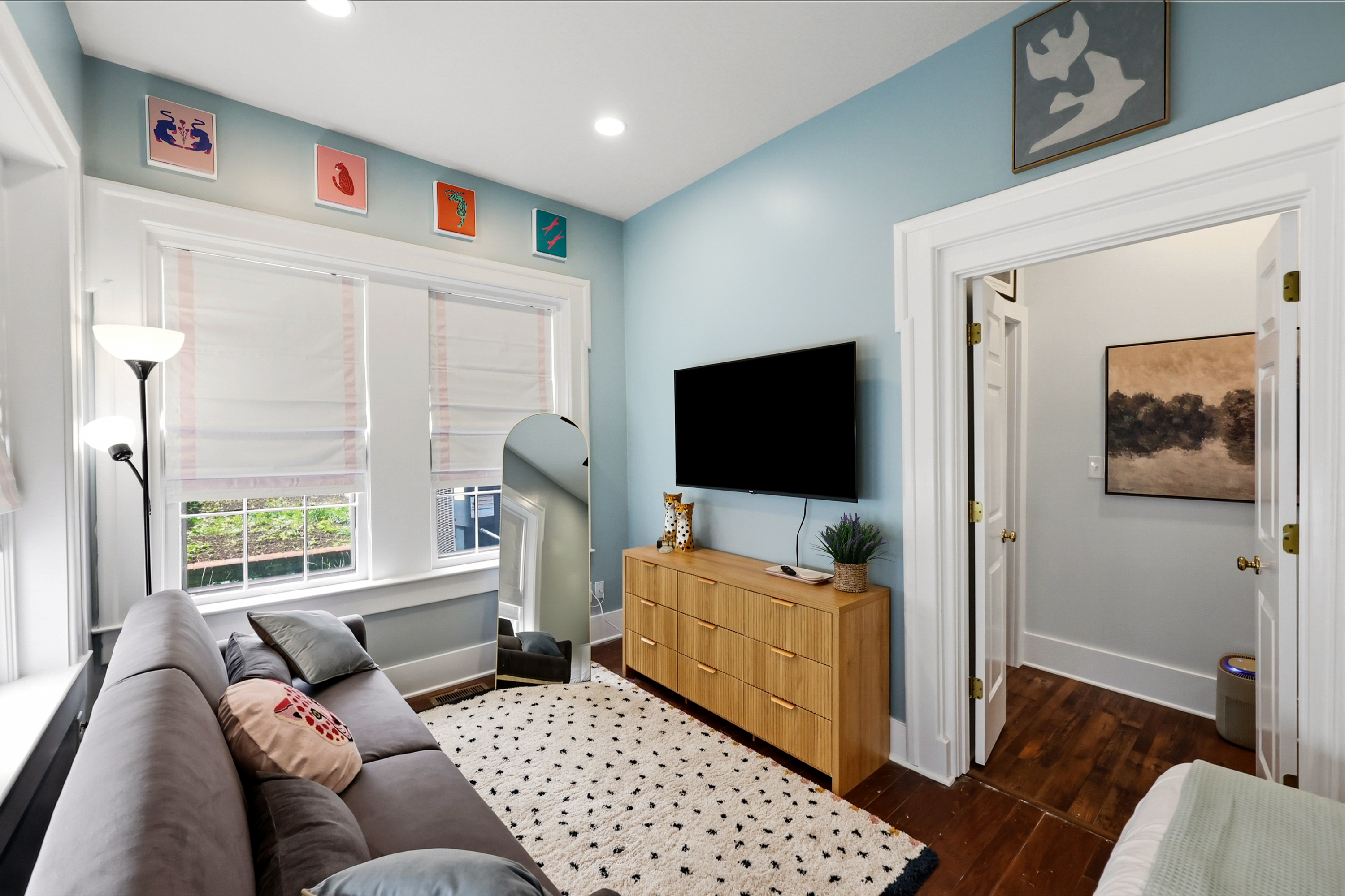 The Whimsy Room. King Bed with a new Nectar mattress, sitting area with a fold-out futon, and lots of natural light.