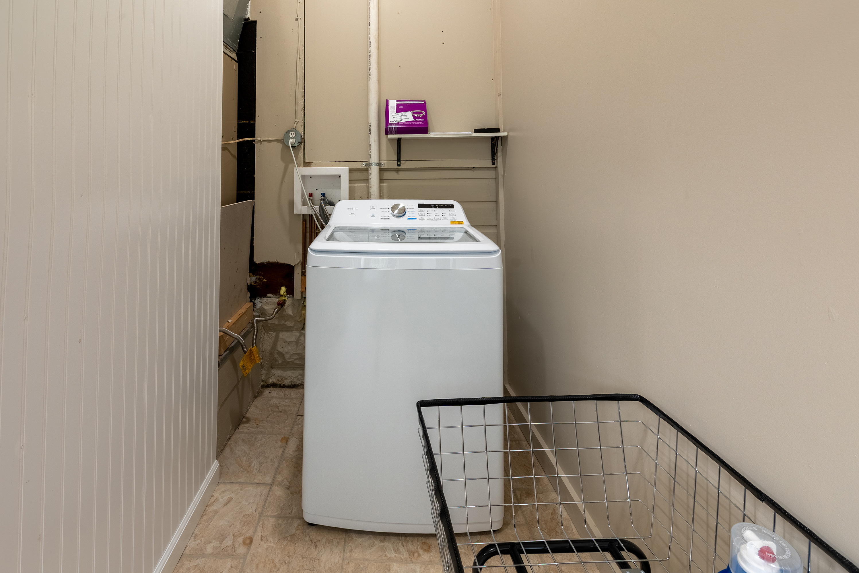 Washer and Laundry Cart in Laundry Room