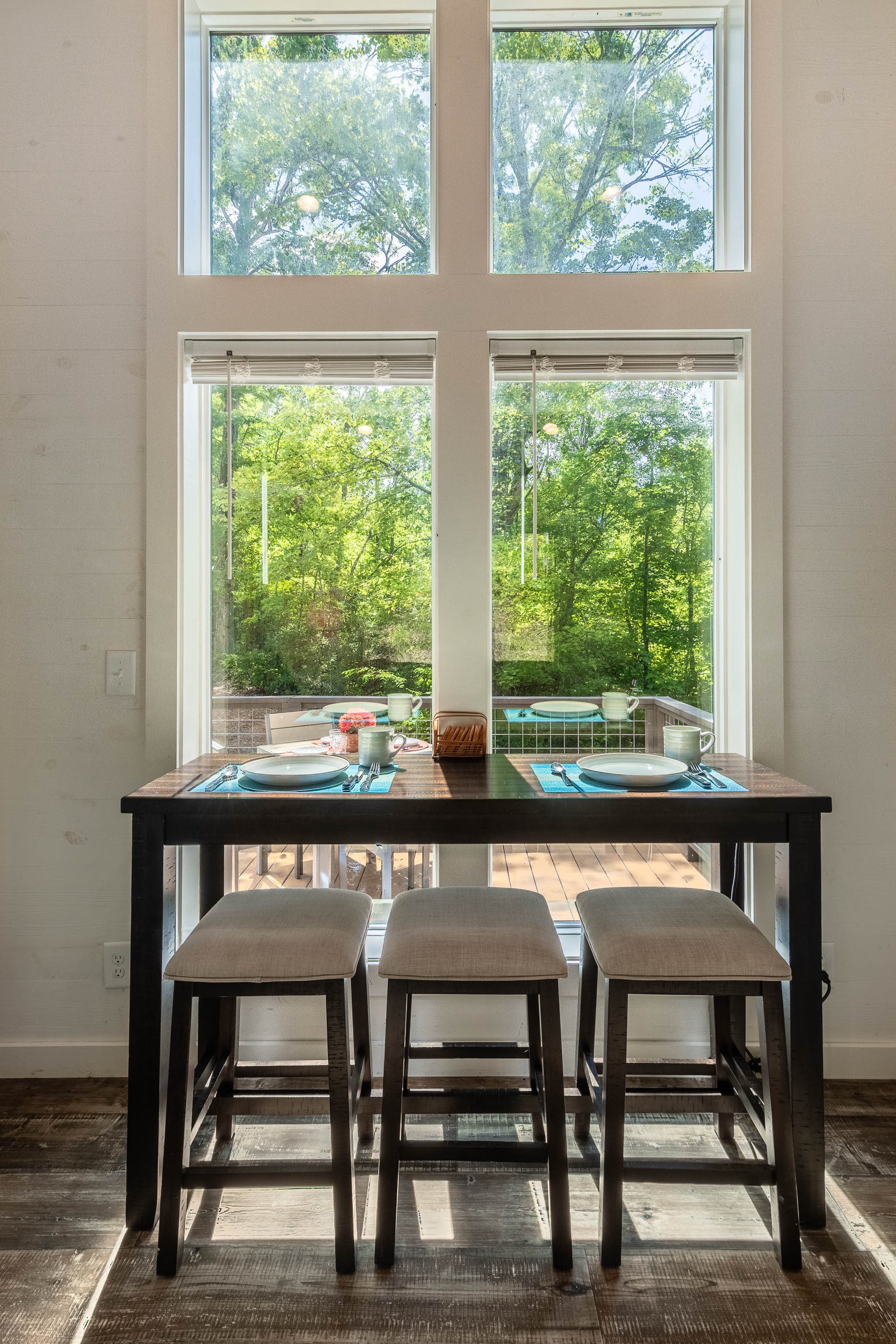Gather at the counter-height table for meals, games, or coffee with a view of the front yard.