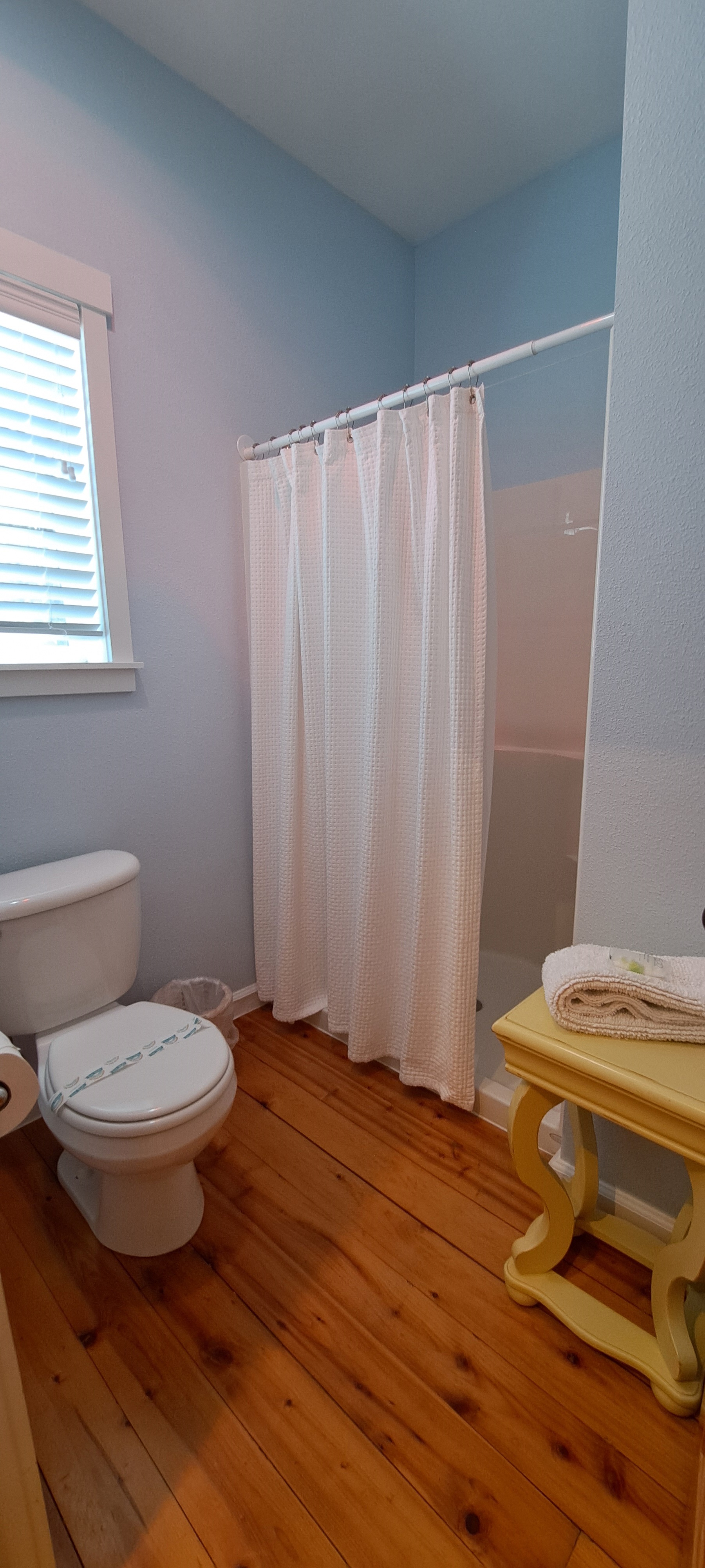 A dedicated shower room enhances the master suite, blending convenience with privacy.