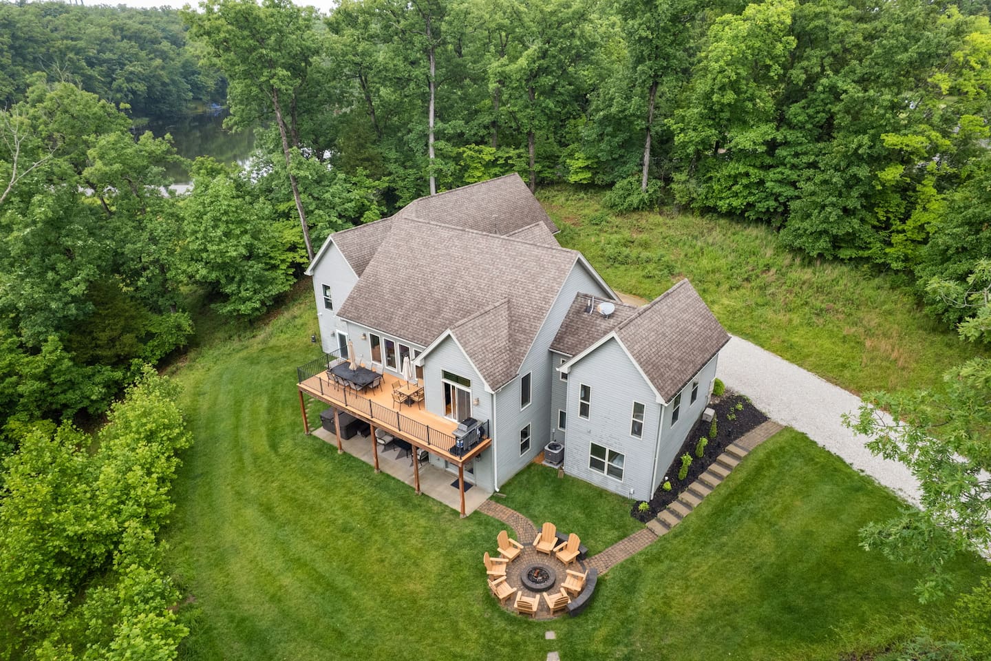This overview showcases the trees that surround the house, providing a peaceful setting for your stay. 