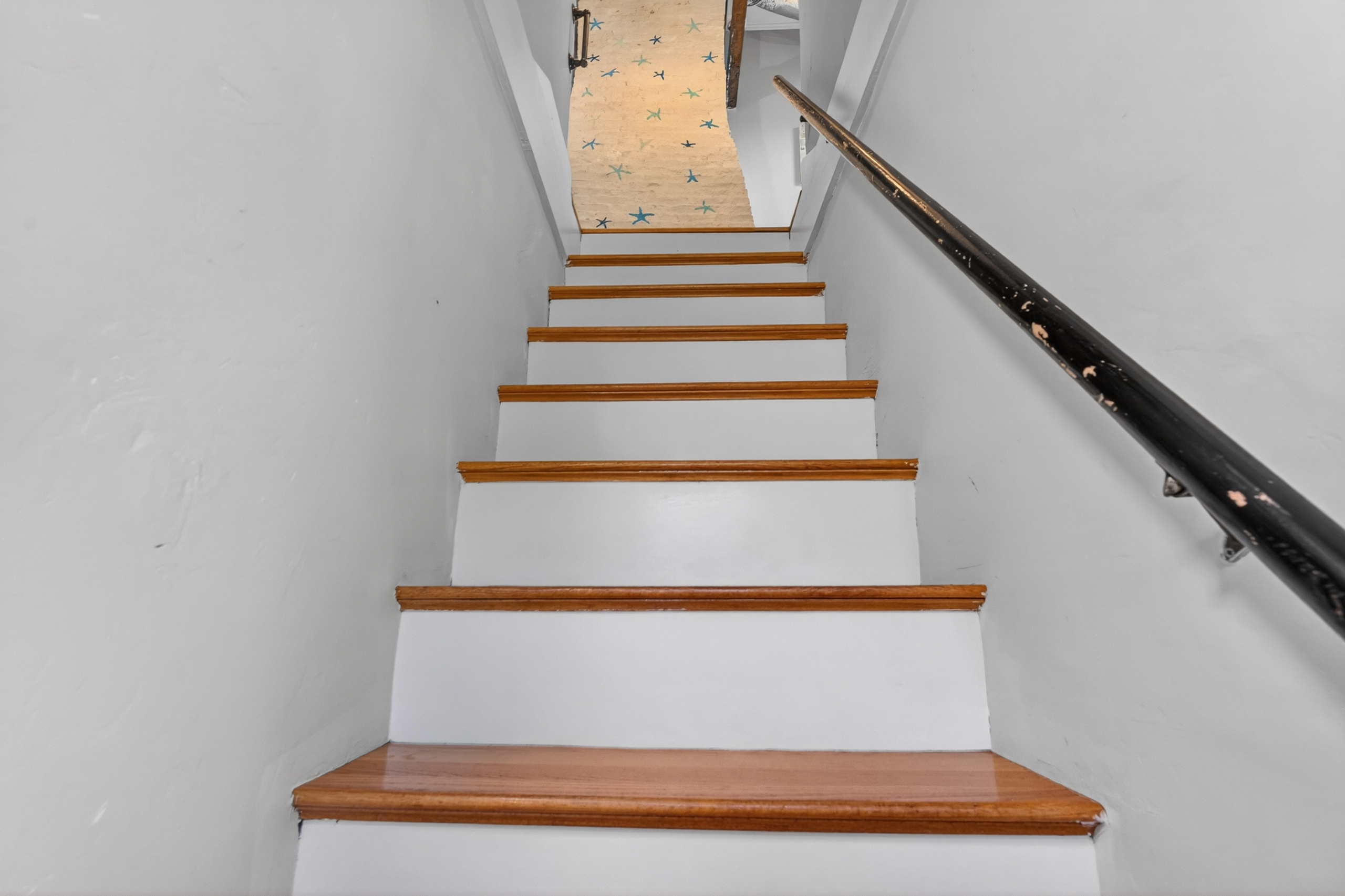 Staircase connecting the home's living spaces with easy access to the upper level.