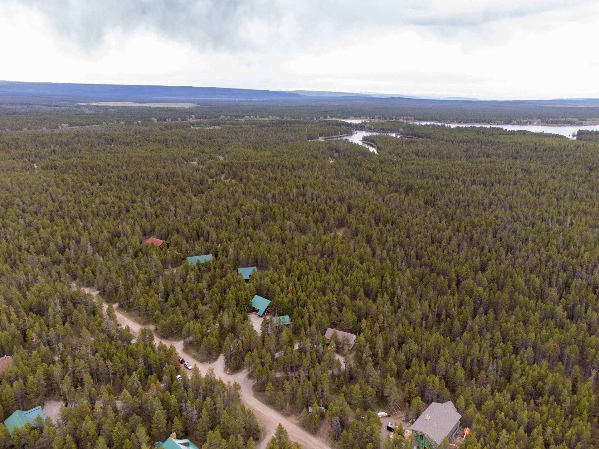 Drone View to Island Park Reservoir fro the cabin with green roof