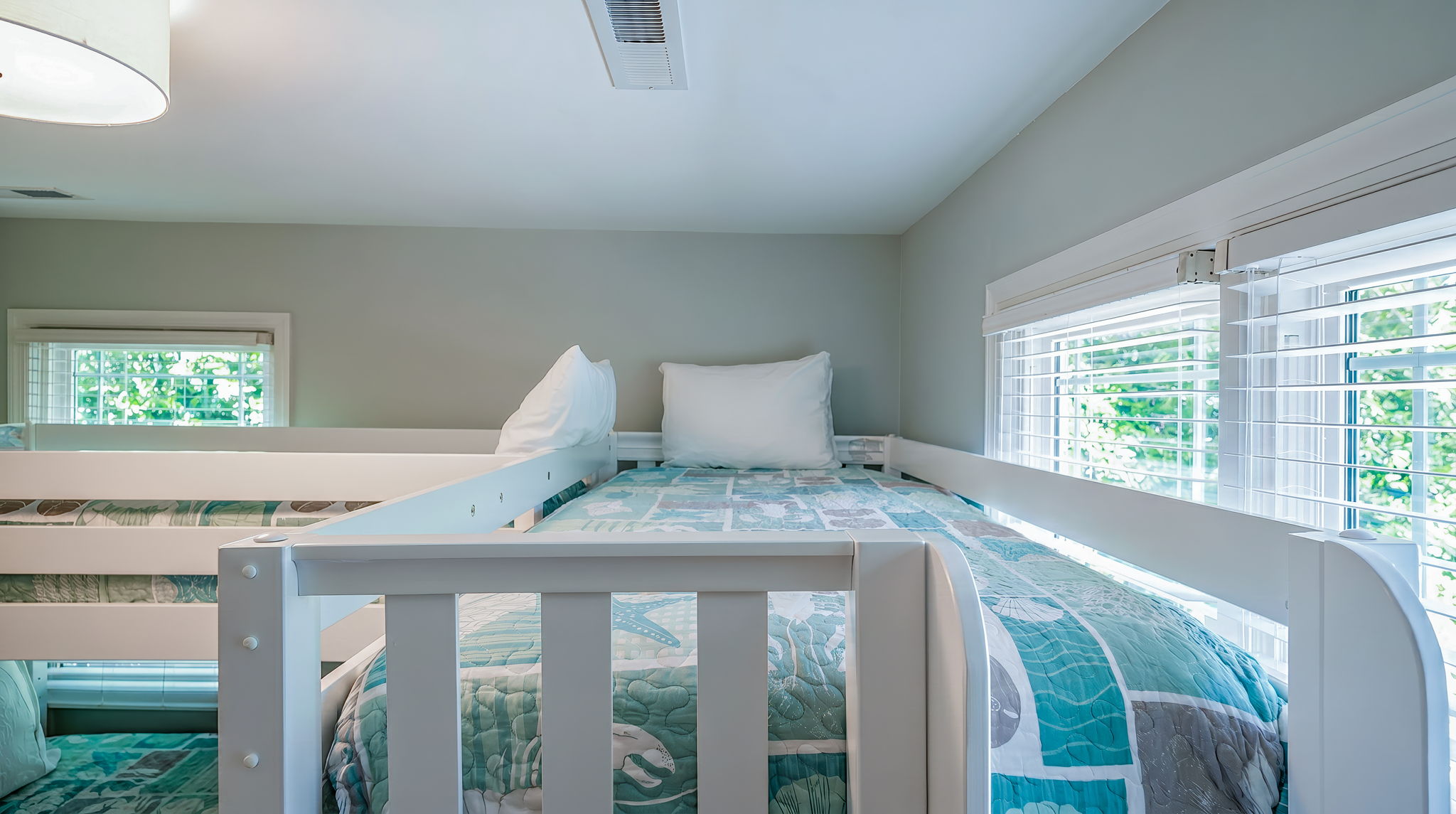 A set of two bunk beds for a fun kid's bedroom!  Updated  beach bedding for a fun retreat! 3705 Hartnett Blvd, Isle of Palms, SC | IOP Escapes