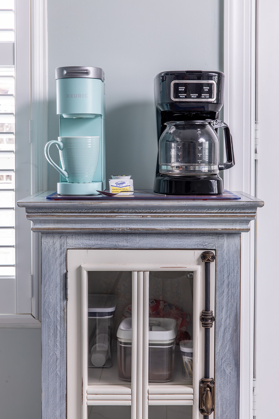 Start the day at the coffee bar, stocked with a brewer, Keurig, filters, grinder, ground coffee, pods, and sweeteners. Brew a cup, step outside, or settle in and ease into the morning.