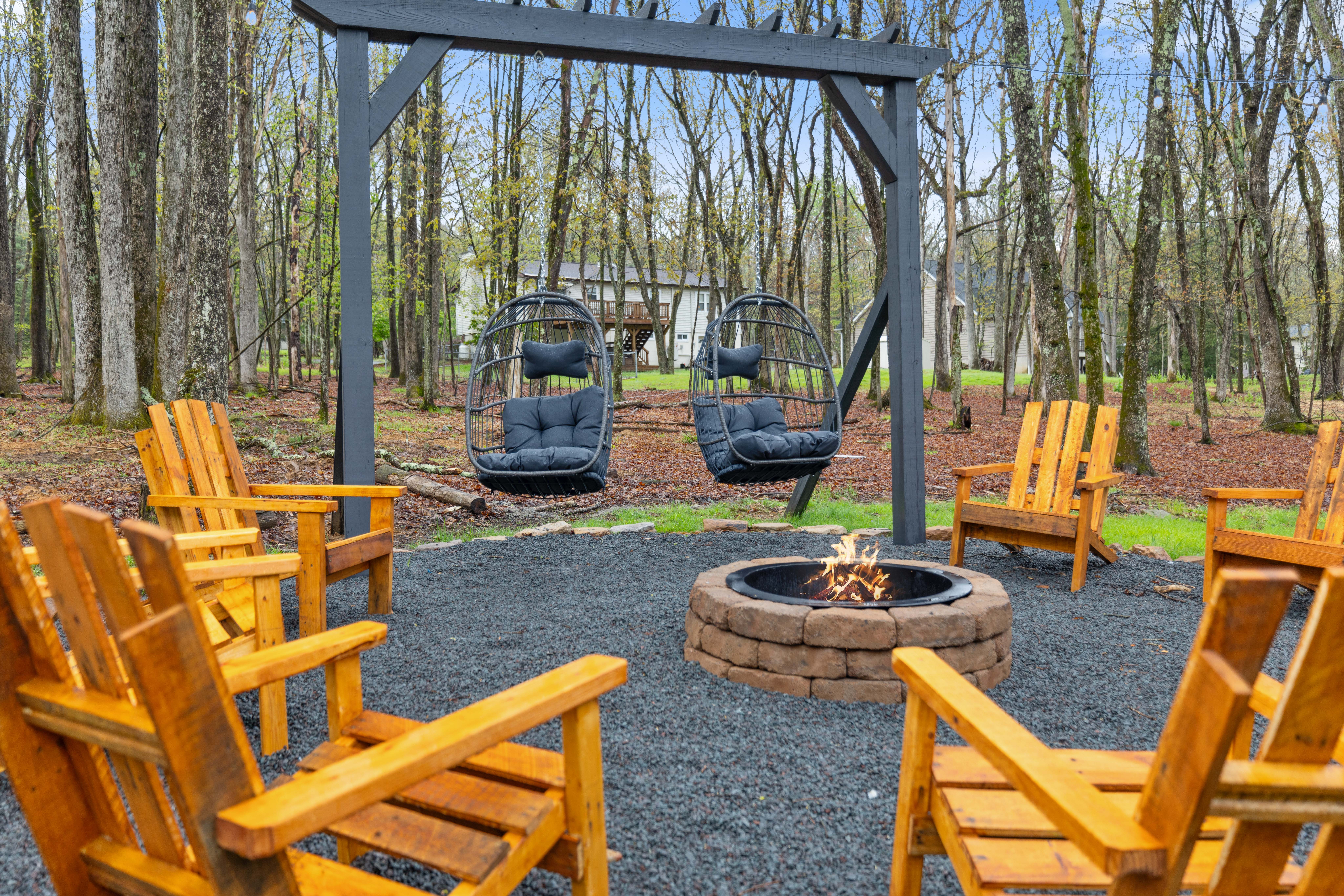 GOAT House fire pit with Adirondack chairs