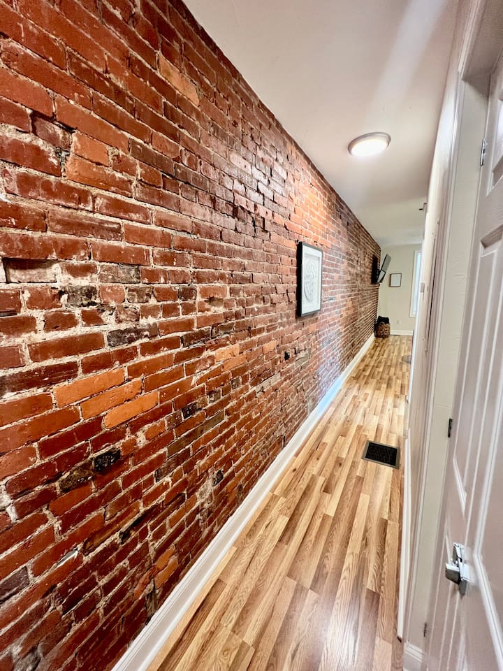 Cozy hallway leading to the bedrooms, offering a seamless flow through the space.