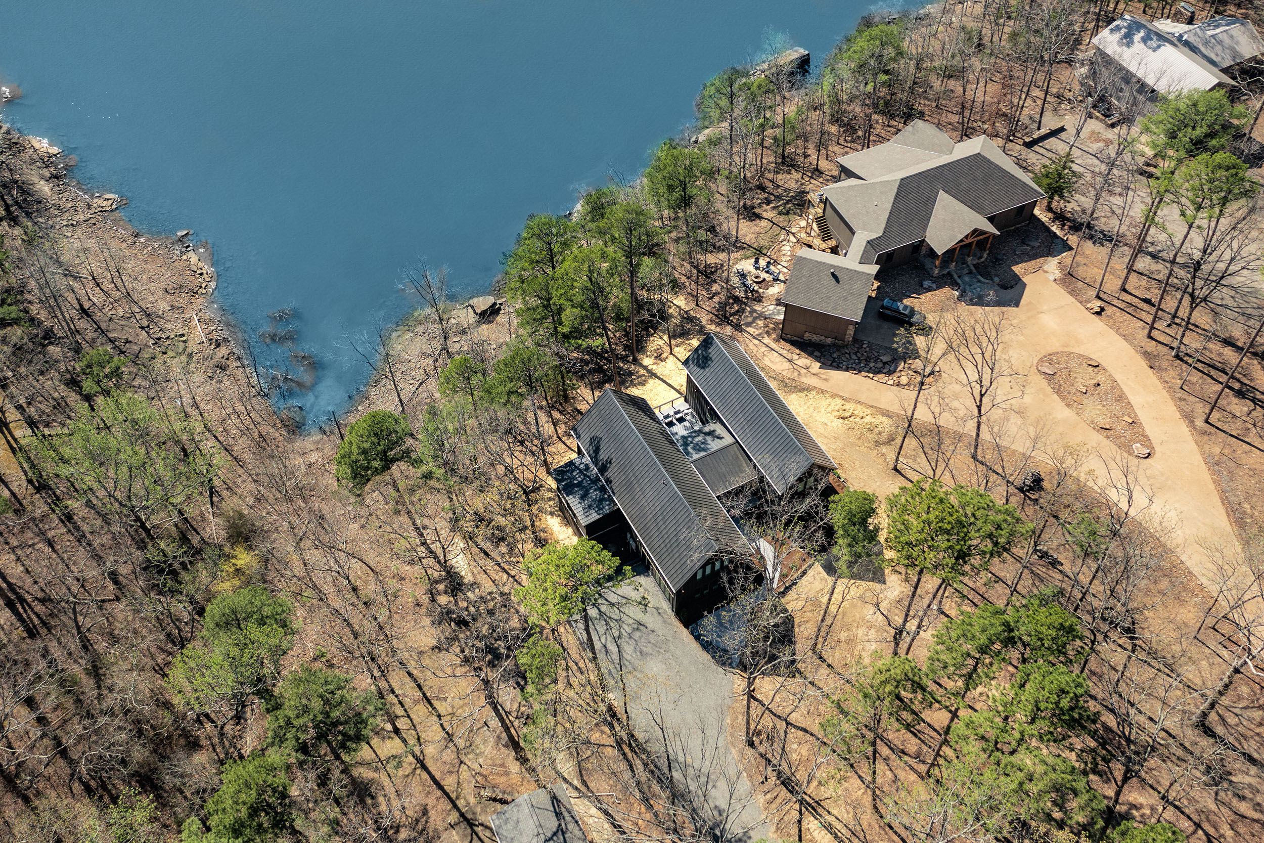 Tucked into the trees and just steps from the lake, Sunset Cove Getaway offers a private escape with unbeatable Greers Ferry views