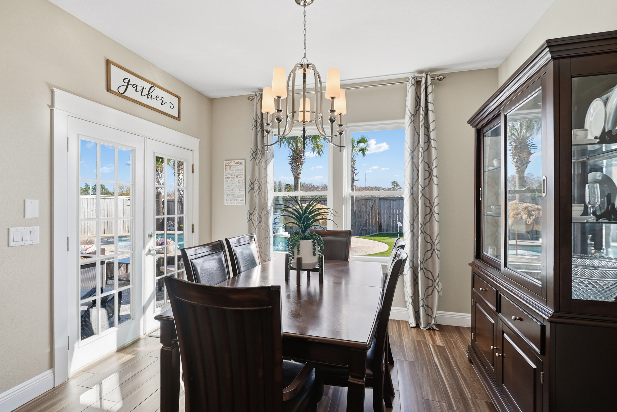 Coastal dining room with natural light and comfortable seating for family gatherings.
