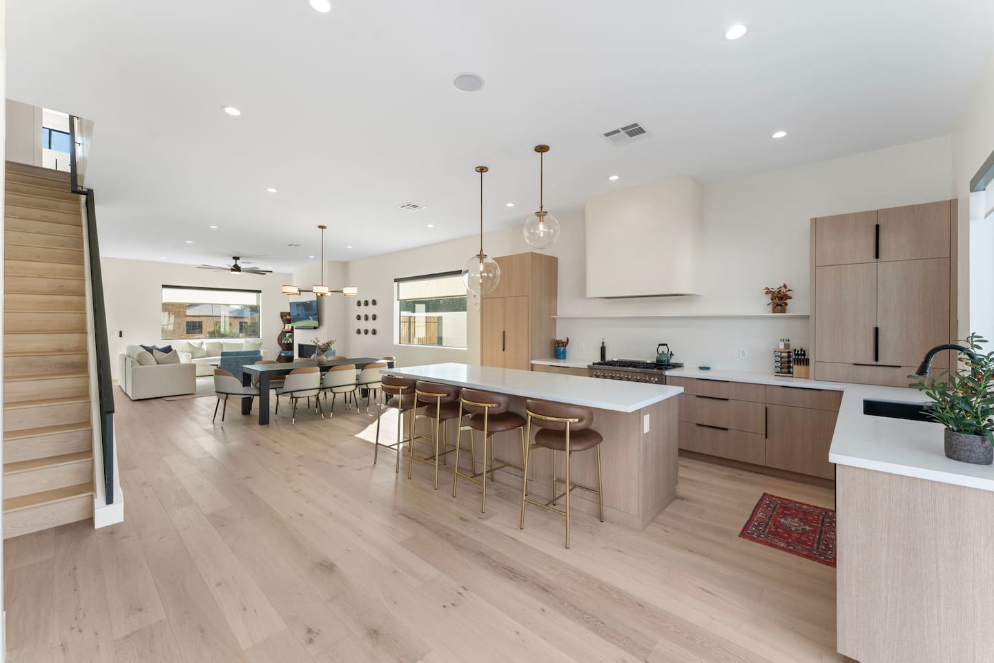 Open-concept living, dining, and kitchen space filled with natural light — perfect for gathering with family and friends.