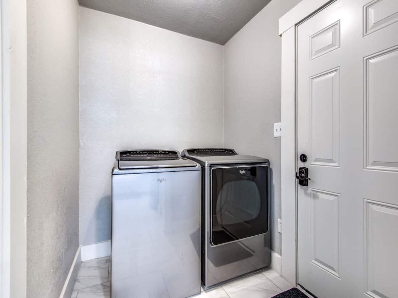 In-unit full-size washer and dryer plus iron, hangers, and drying rack. Rare convenience for short-term rentals in Aubrey TX. Ideal for extended stays and multi-night wedding weekends near Lake Ray Roberts and Denton County.