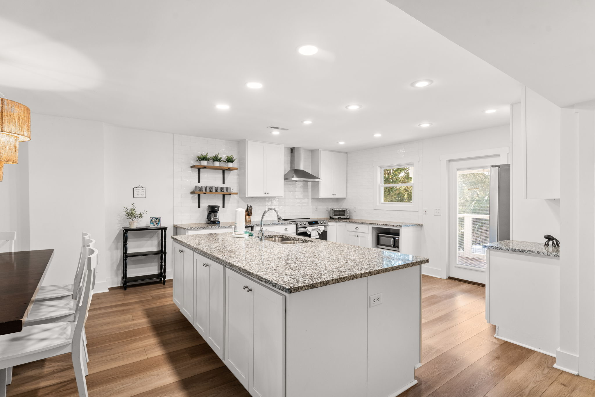 Side B: Designed as a chef’s dream, each kitchen features modern recessed lighting and ample cabinet storage