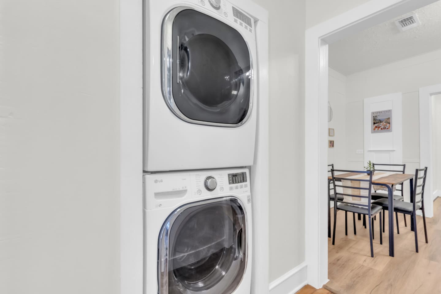 Laundry room with washer and dryer for guest convenience.