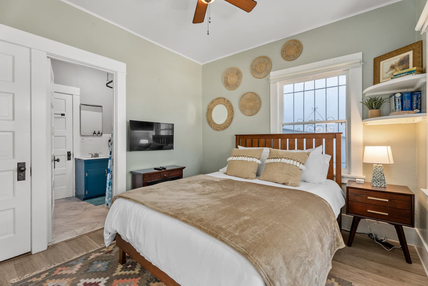 Bedroom with a queen bed, boho decor