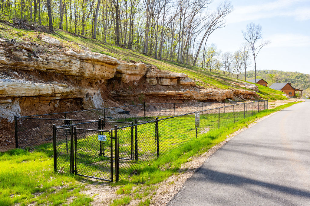 Bring the pup along ,  the fenced, off-leash dog park sits tucked against a striking Ozark rock bluff.