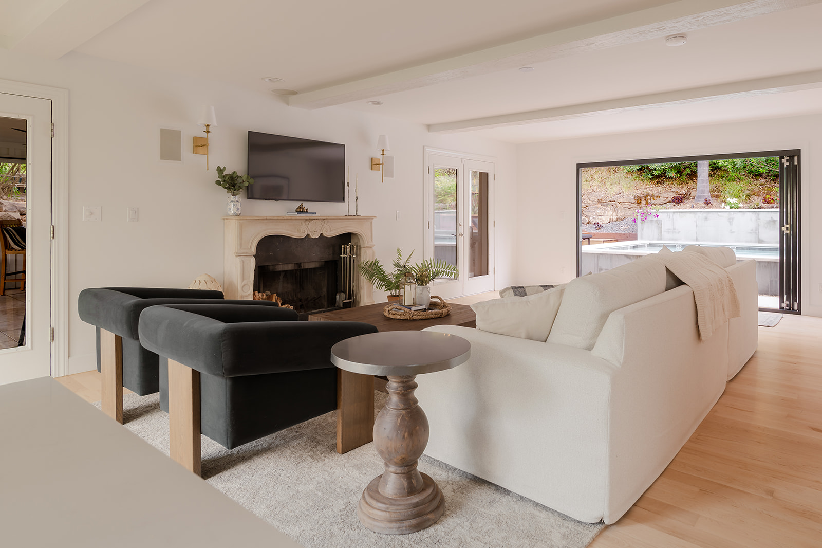 Comfortable Family Room Opens to the Pool