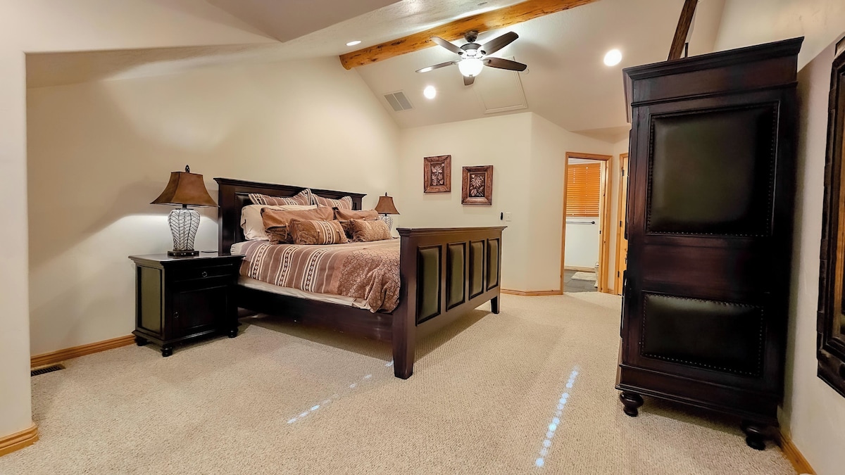 The primary bedroom suite boasts a luxurious king-sized bed, an ensuite bathroom and ample storage space.