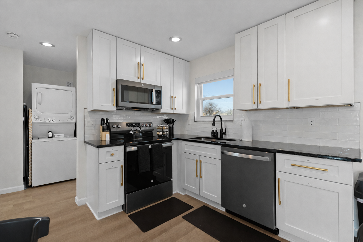 Bright, modern kitchen with full-size appliances, ample cabinet space, and sleek finishes—perfect for home cooking, meal prep, and longer stays.