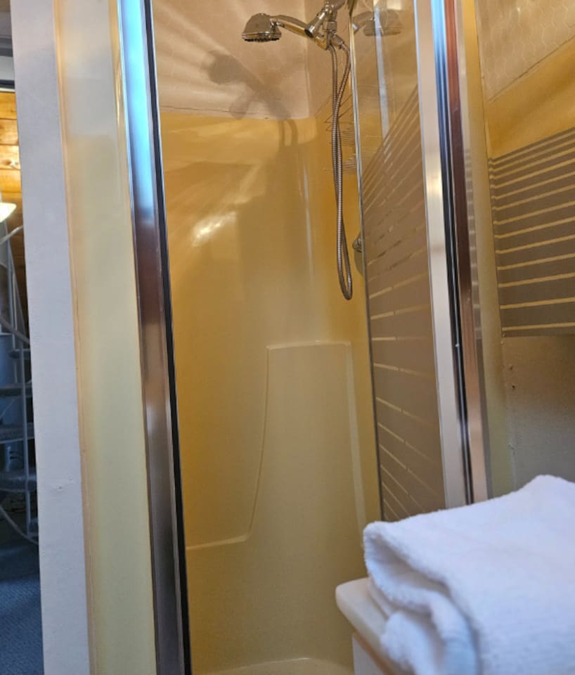 Stand up shower located in the bathroom on the second floor.