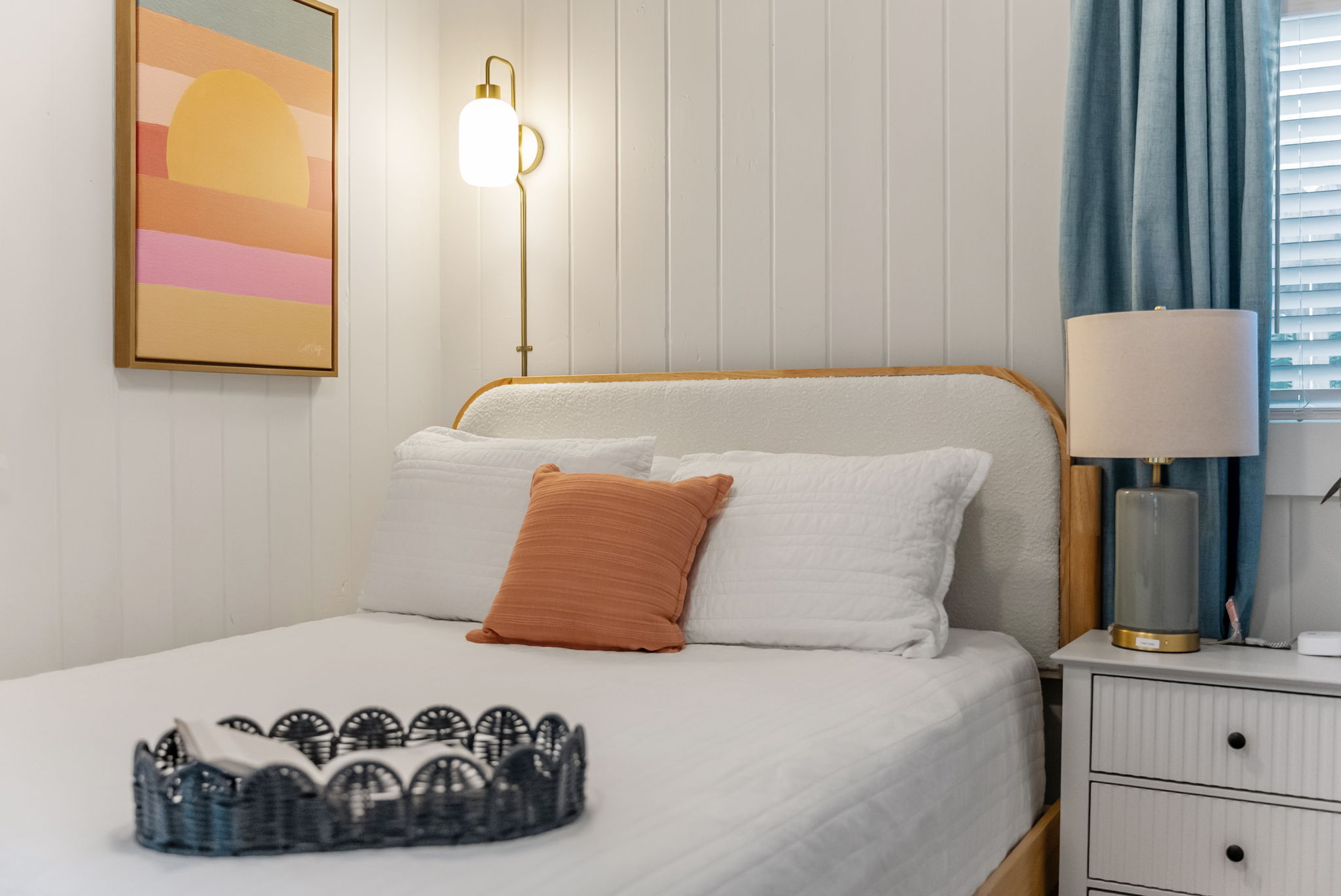 The back bedroom has a Queen bed that comfortably fits 2, plenty of lighting, and a TV to stream movies before bed or during that afternoon nap. 