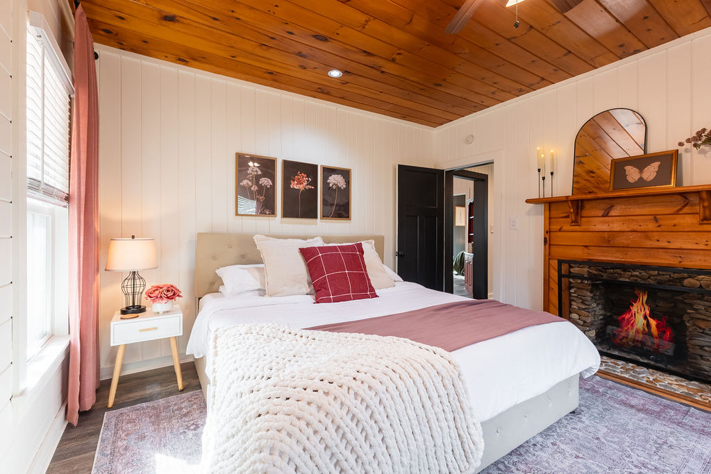 Drift off beside the glow of your own fireplace &mdash; a quiet retreat at the heart of the cabin.