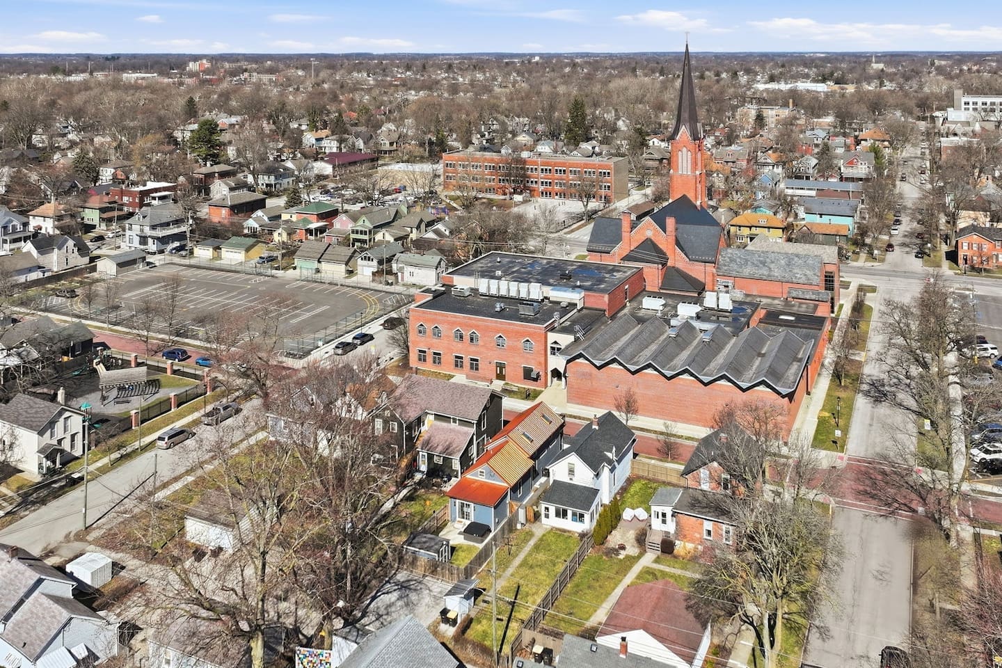 Wide overhead shot capturing the vibrant neighborhood and convenient location near key attractions