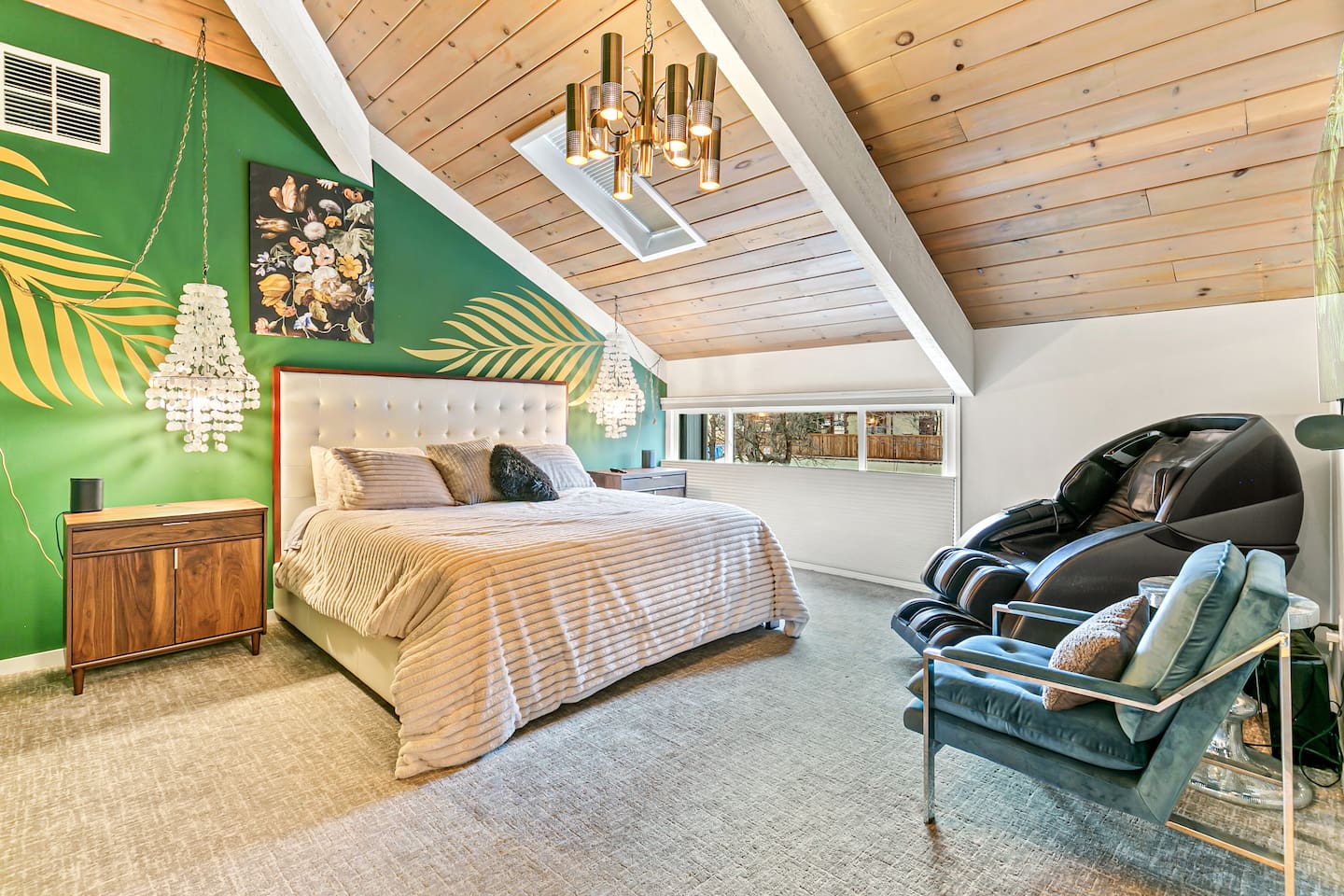 The master bedroom is furnished with a luxurious king bed, electric massage chair, flat screen TV, a private bath, a bidet toilet, a dual shower head, a twin sink setup, and a private closet for your convenience.