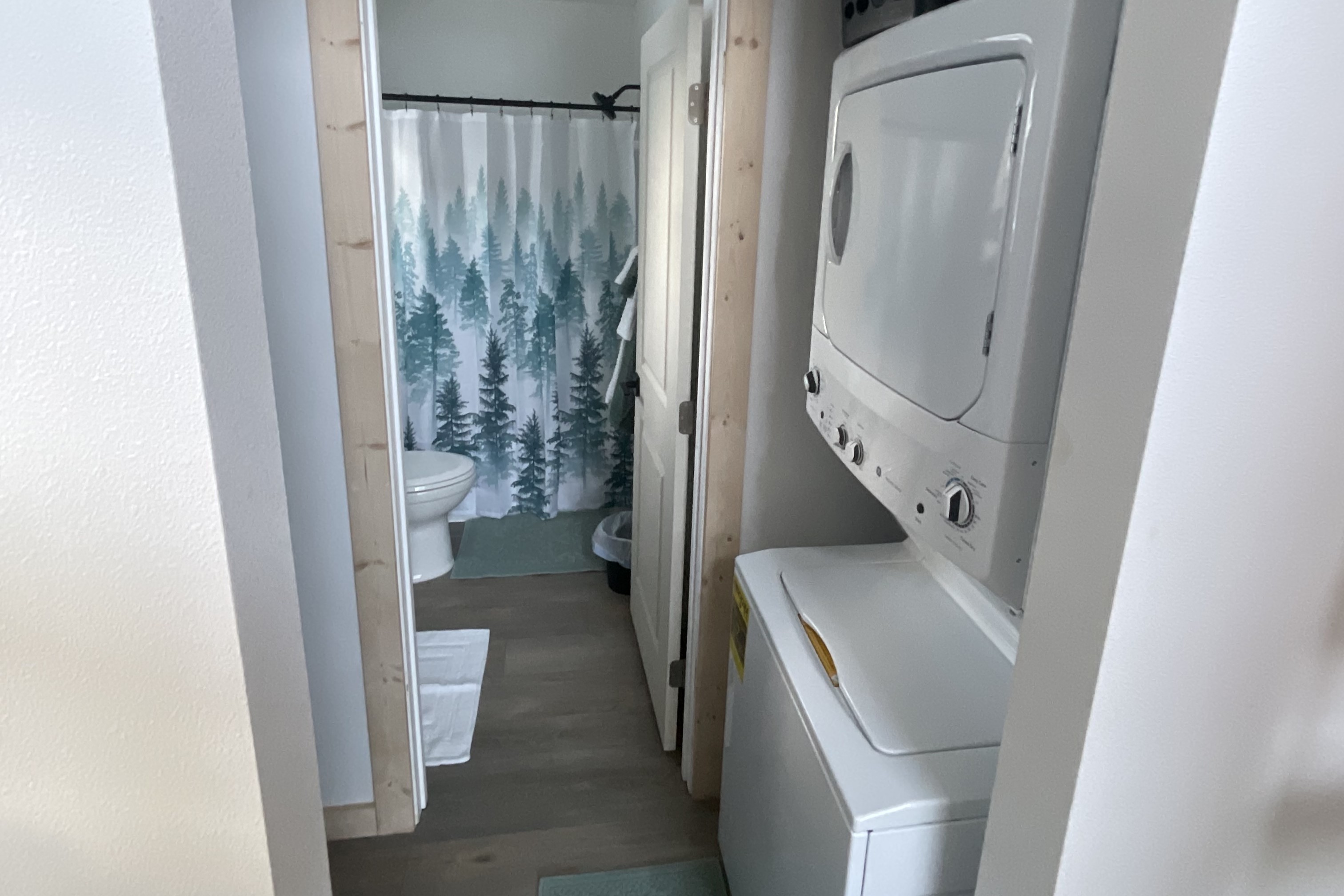 Washer/Dryer located just outside of the bathroom door.