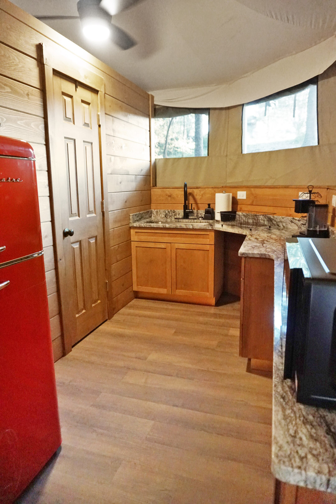 Retro vibes with a red fridge and scenic views—perfect for culinary adventures!