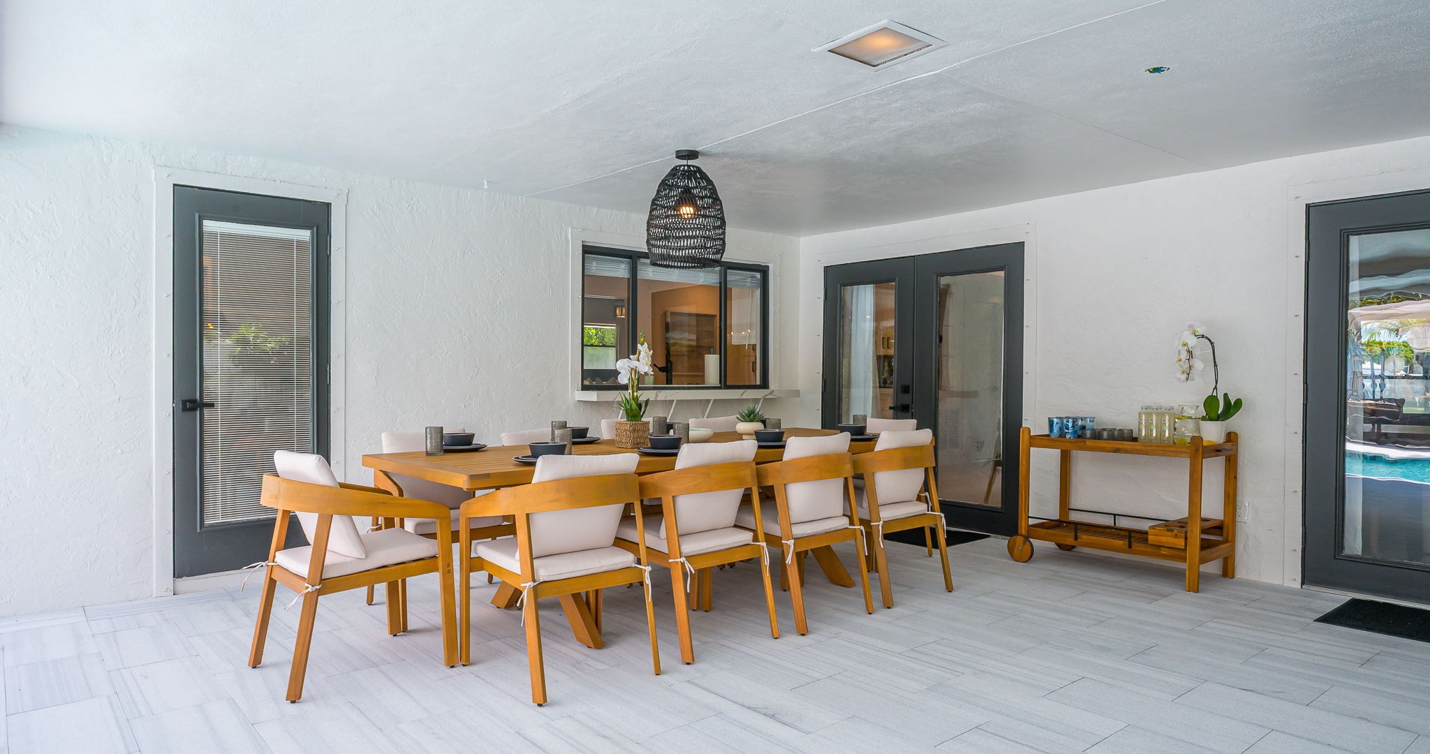 Designed for luxury and comfort, this outdoor space invites you to dine, relax, and unwind in true resort fashion. Enjoy poolside loungers, shaded patio seating, and an ambiance that blends modern elegance with the ease of Florida living