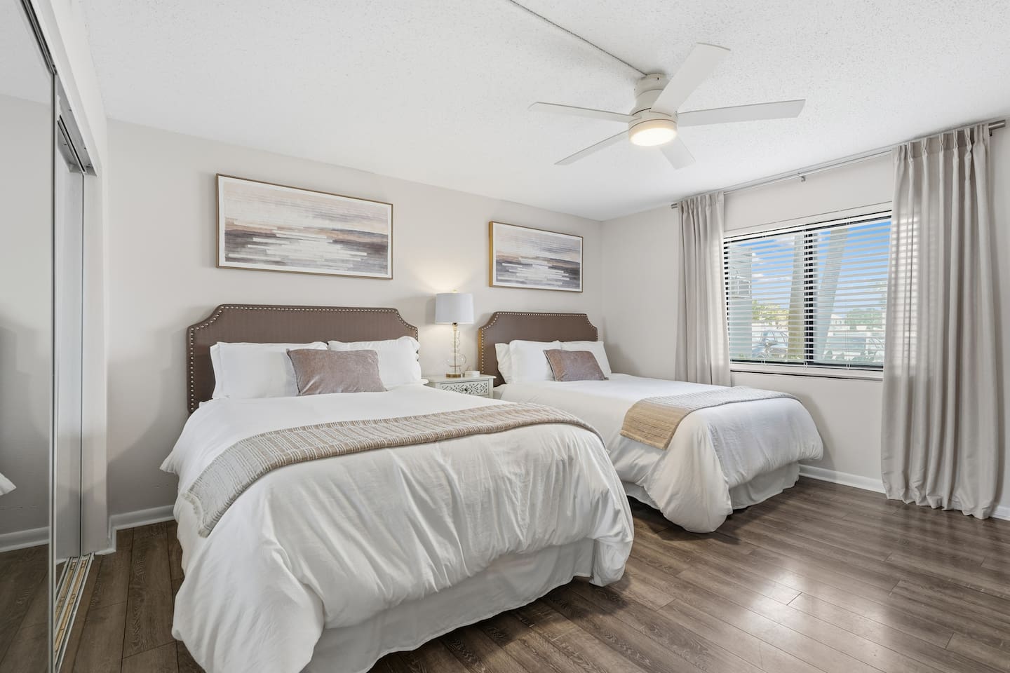 The guest bedroom has 2 queen beds