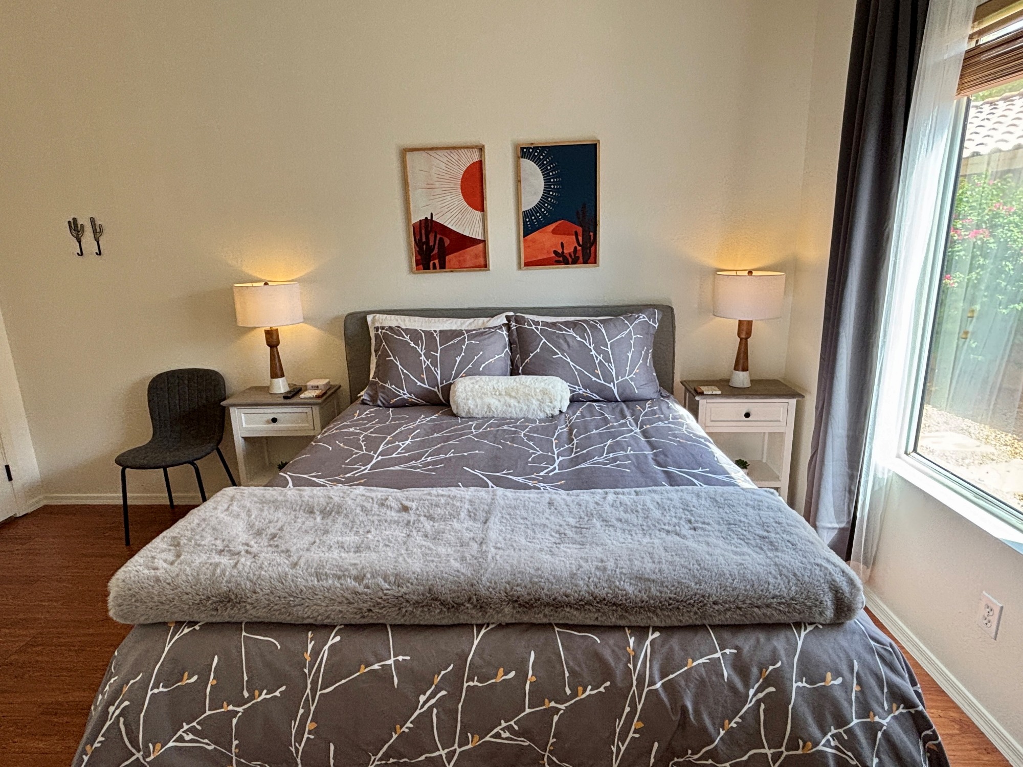 Queen bedroom on main floor with 55" Smart Tv and blackout curtains