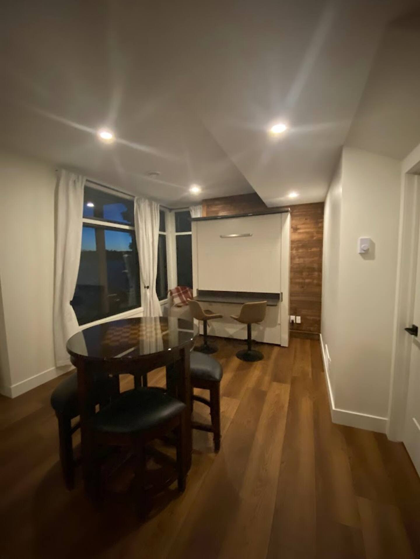 Lower level workspace against collapsed murphy bed