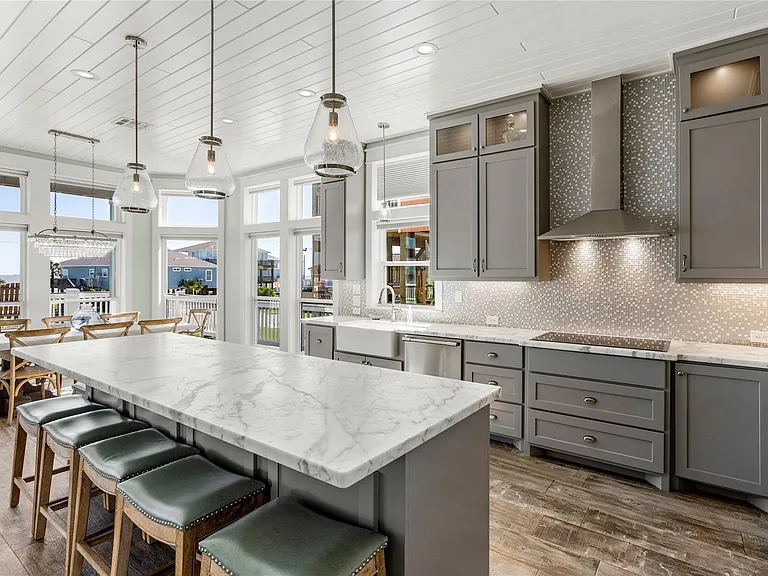 Crystal Paradise Kitchen: Bright, open kitchen designed for culinary enthusiasts, featuring panoramic ocean views.