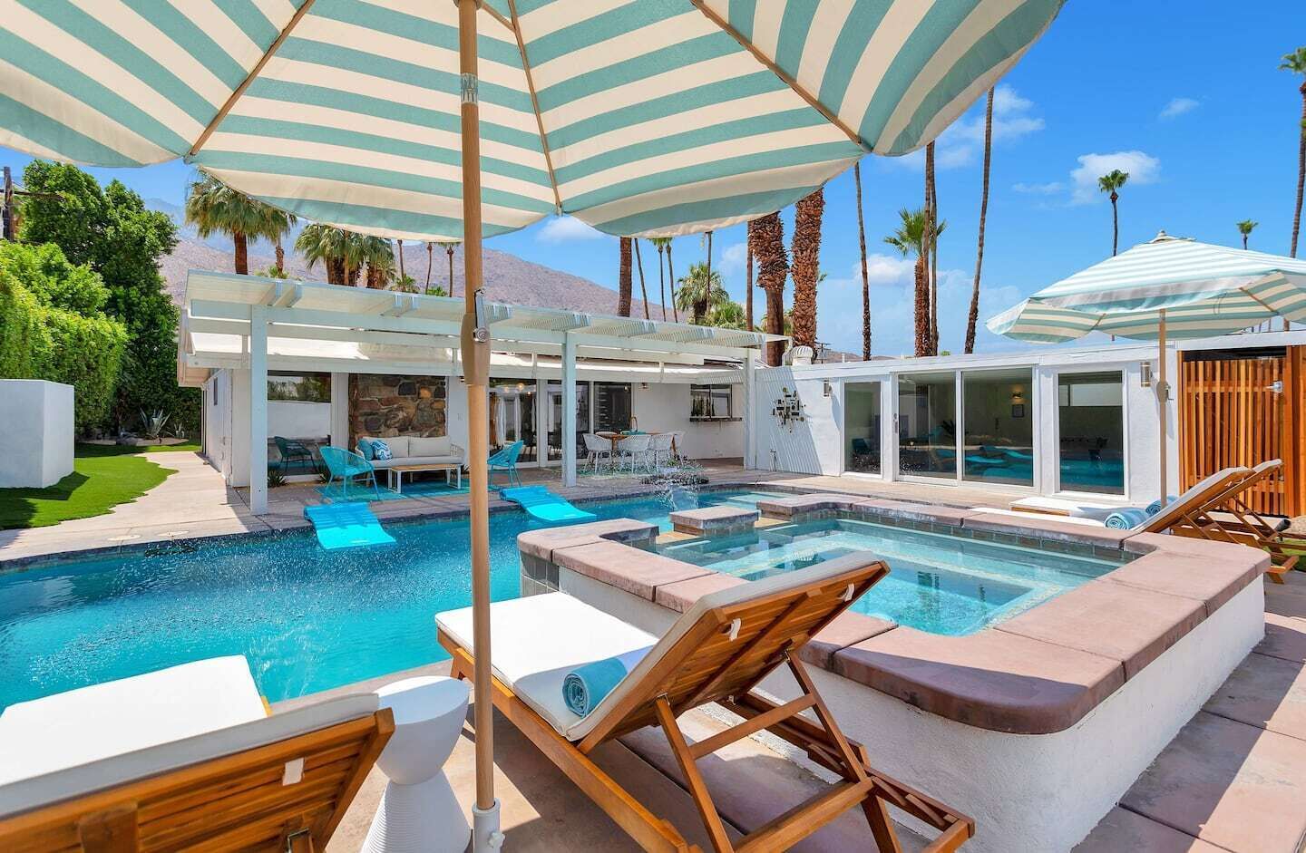 Private secluded pool with views of mountains, sky and palm trees