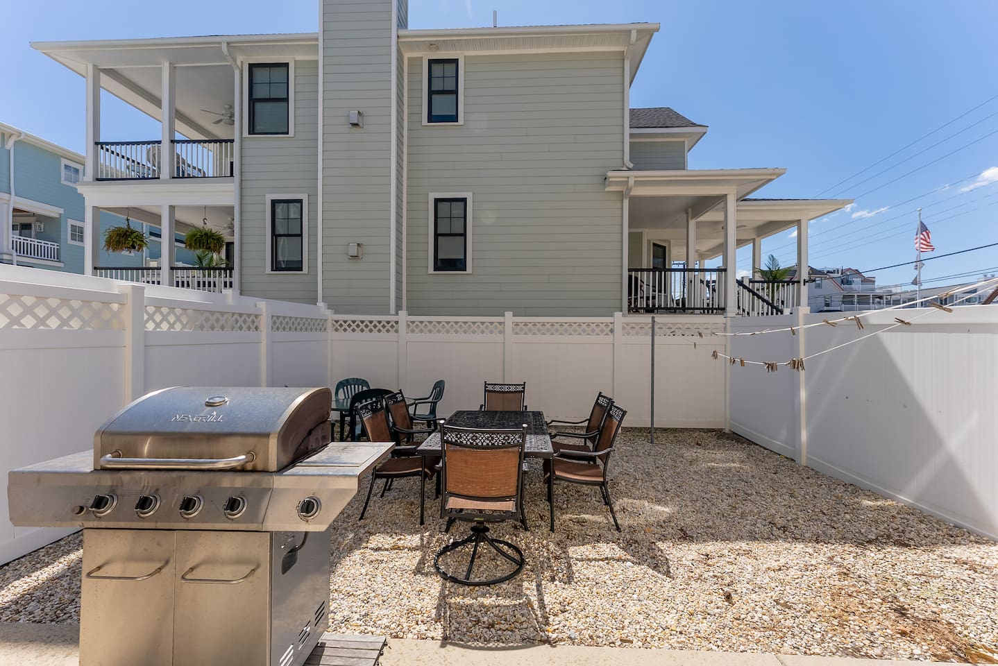 Spacious private fenced in back yard with ample seating, BBQ grill, outdoor shower and clothes line.