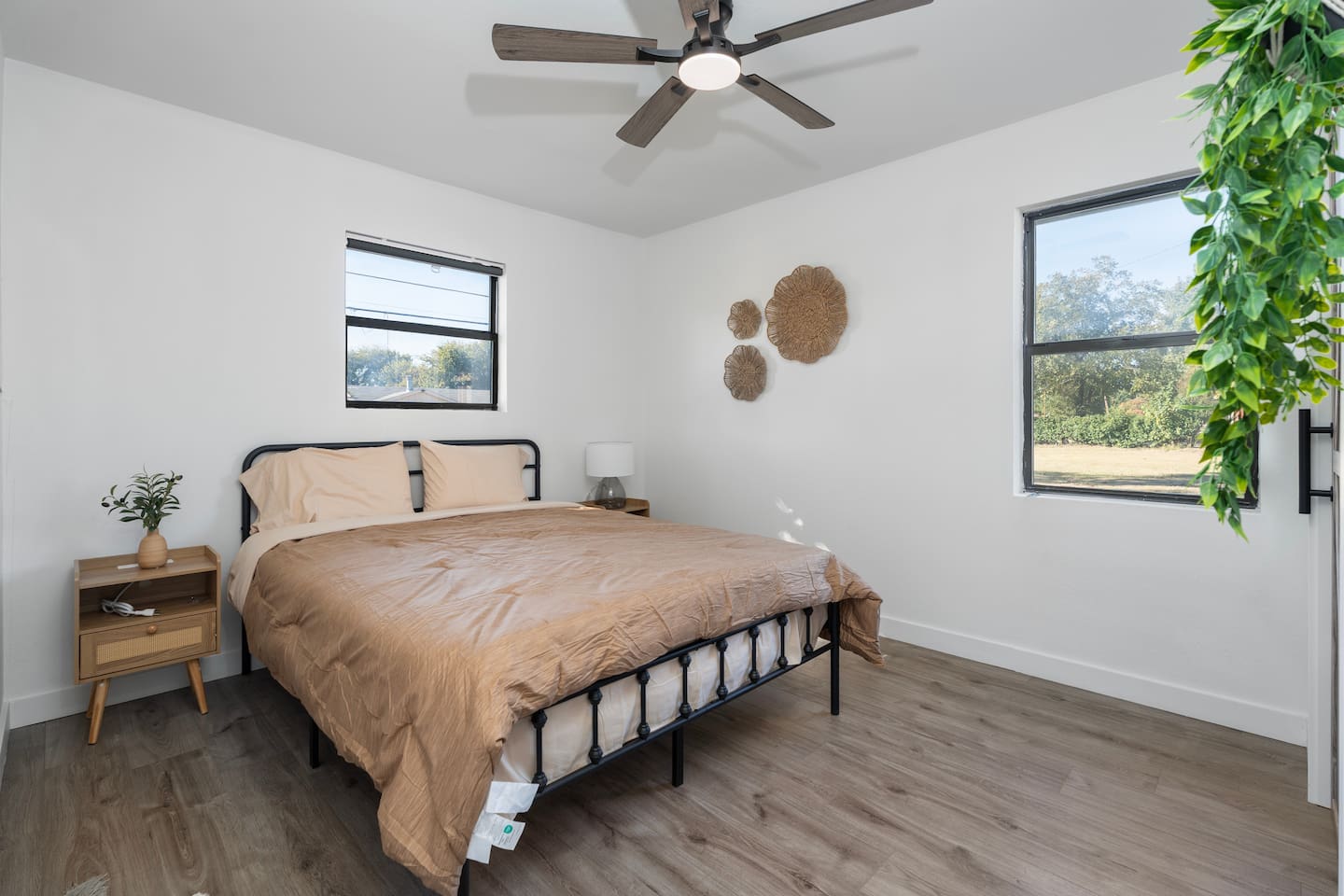 Simple and stylish second bedroom offering clothing storage, ceiling fan, and fresh bed linens. Perfect for couples, friends or visiting family.