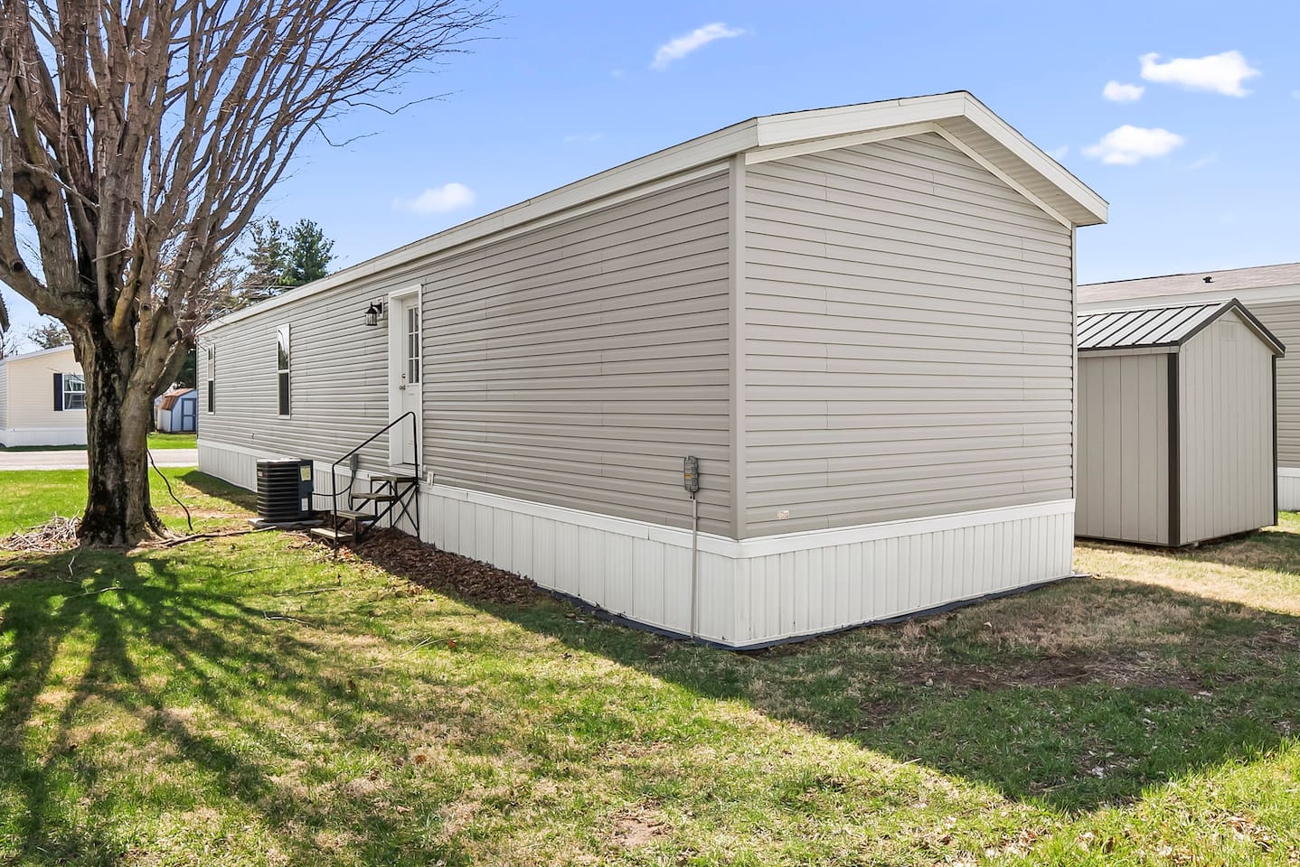 Side view of the home with private yard space and easy secondary access—perfect for extended stays.