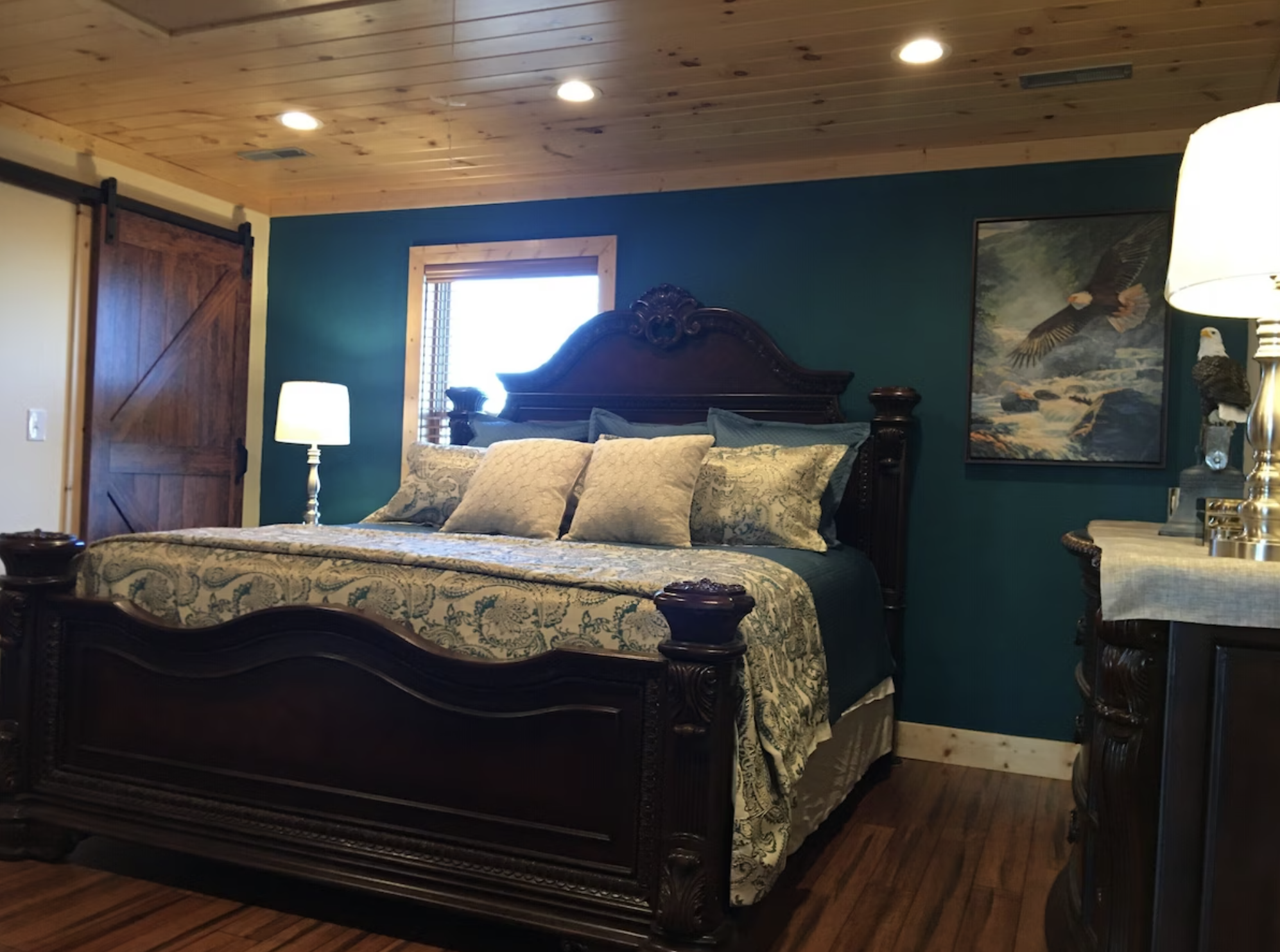 The Soaring Eagle Room is magnificent with a grand King Bed and a large barn-style door to your bathroom.