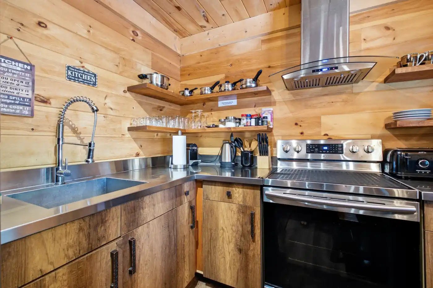 Fully equipped kitchen with rustic wood cabinetry