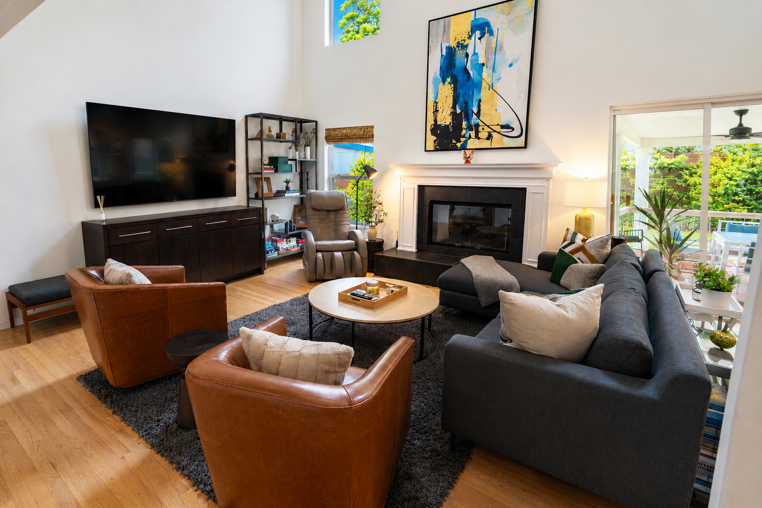 Living area with smart tv, massage chair and fireplace.