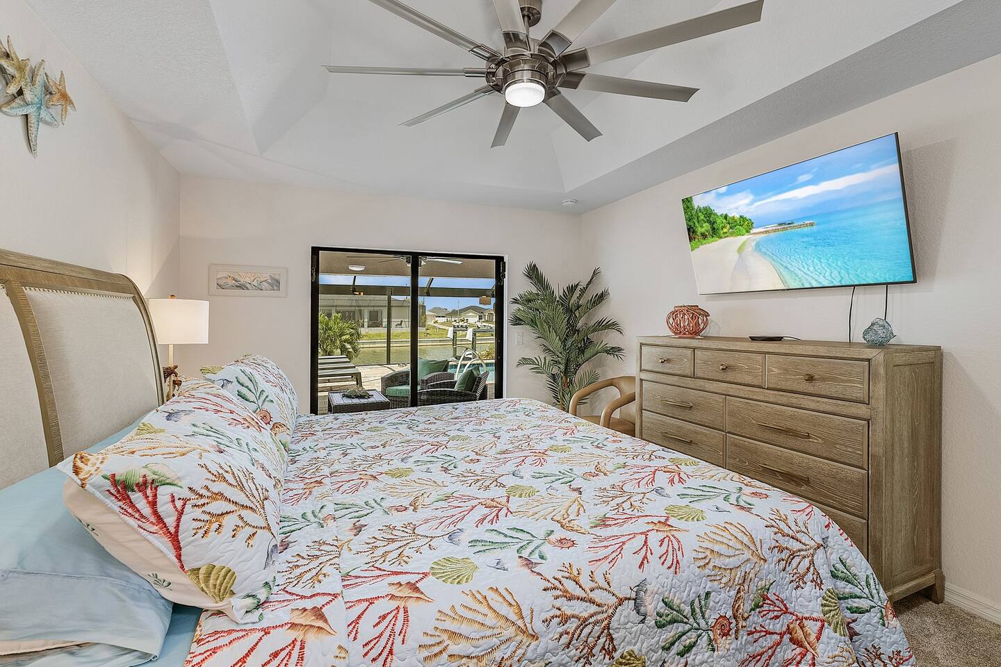 Primary suite with direct access to pool and lanai area.