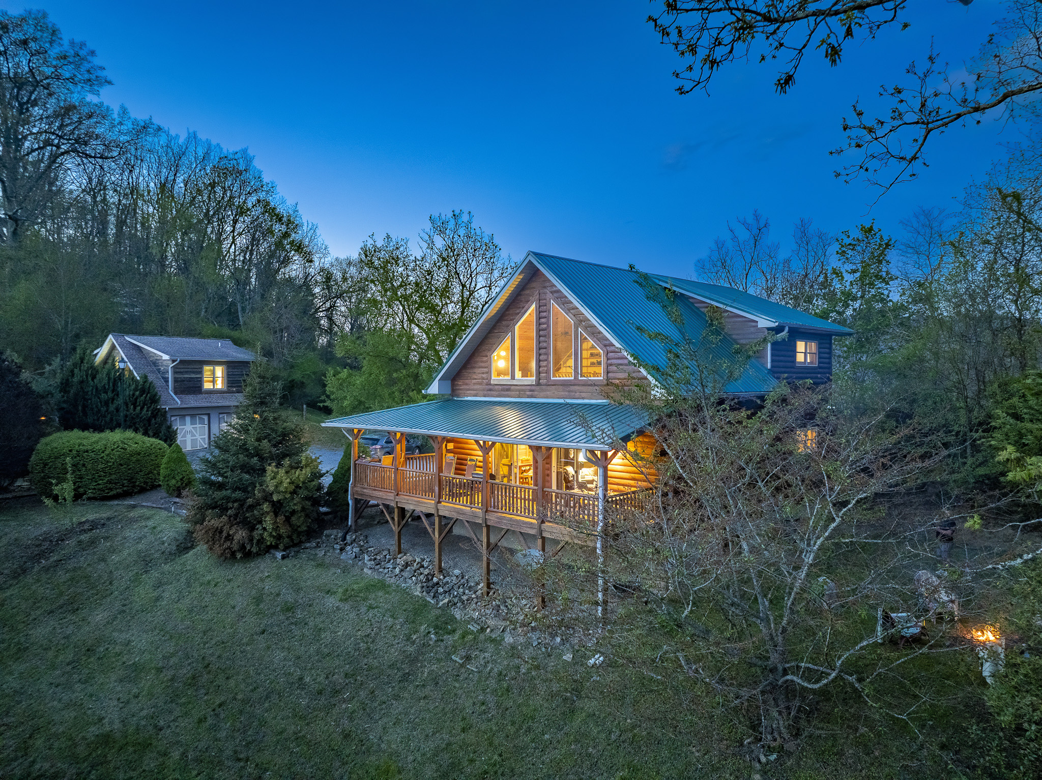 Exterior: Embrace mountain magic in this charming cabin with stunning views and inviting porches!